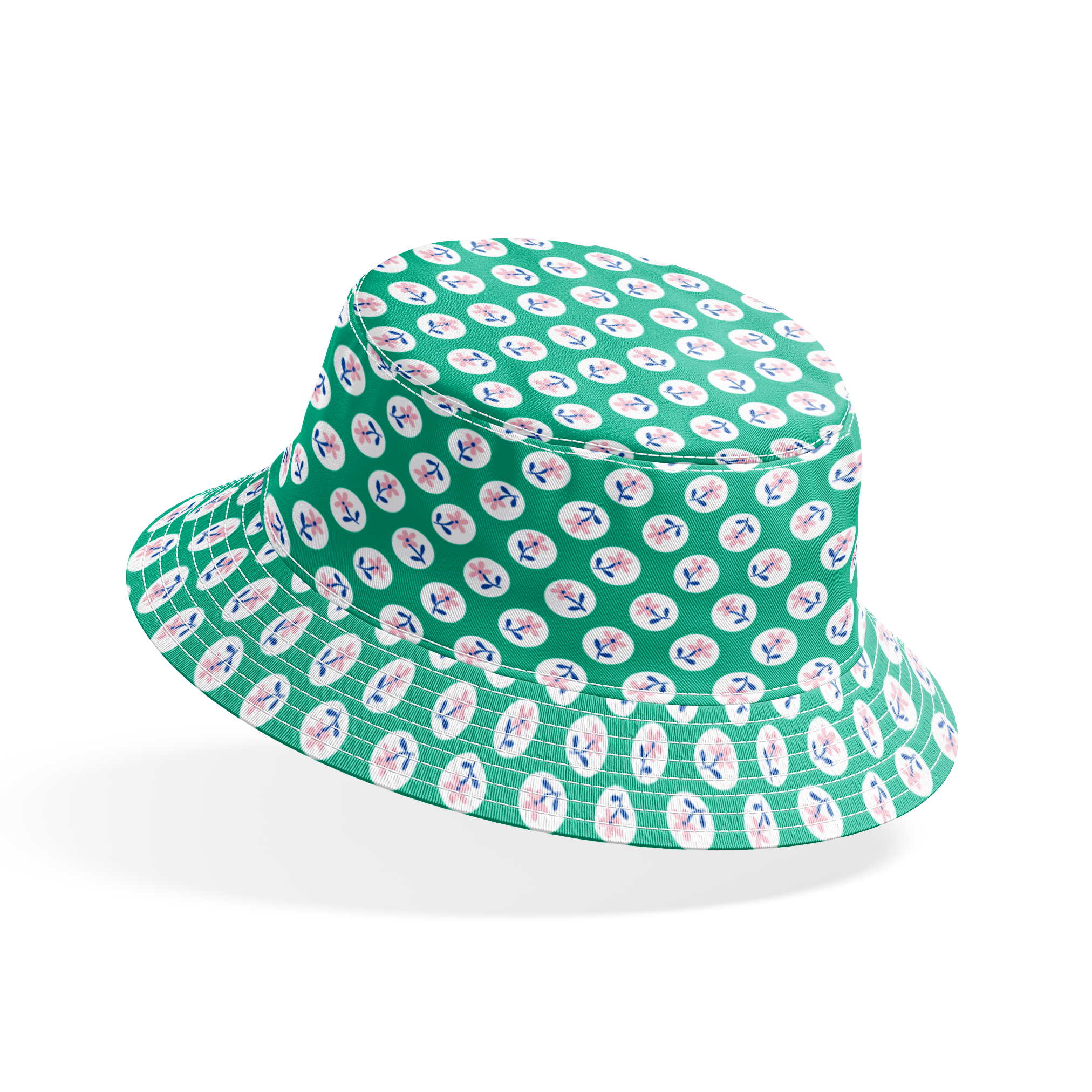 Pink flower motifs with blue stems on white circles against a green background bucket hat mockup