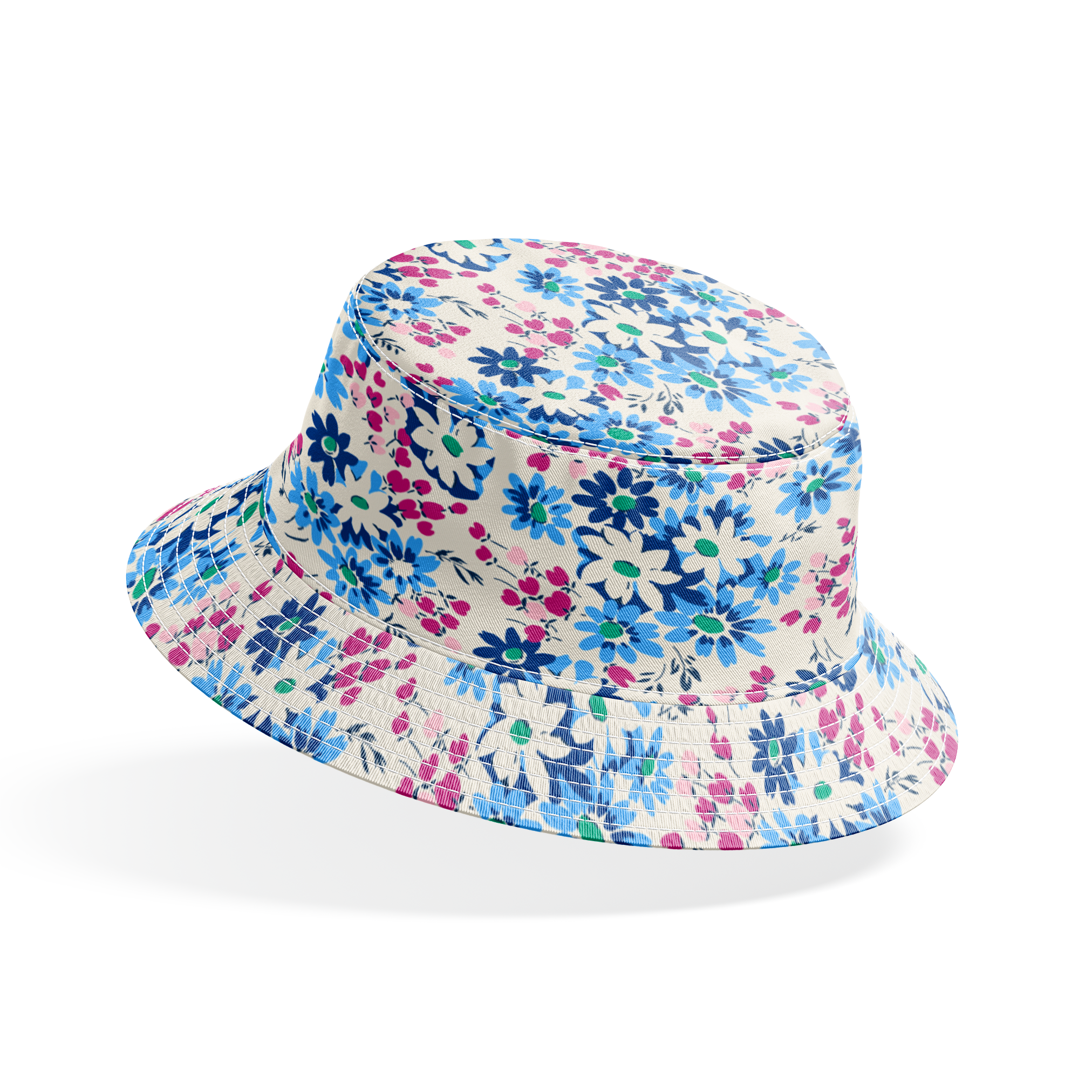 Floral pattern with blue, navy, and white daisies alongside small magenta berries on cream background bucket hat mockup