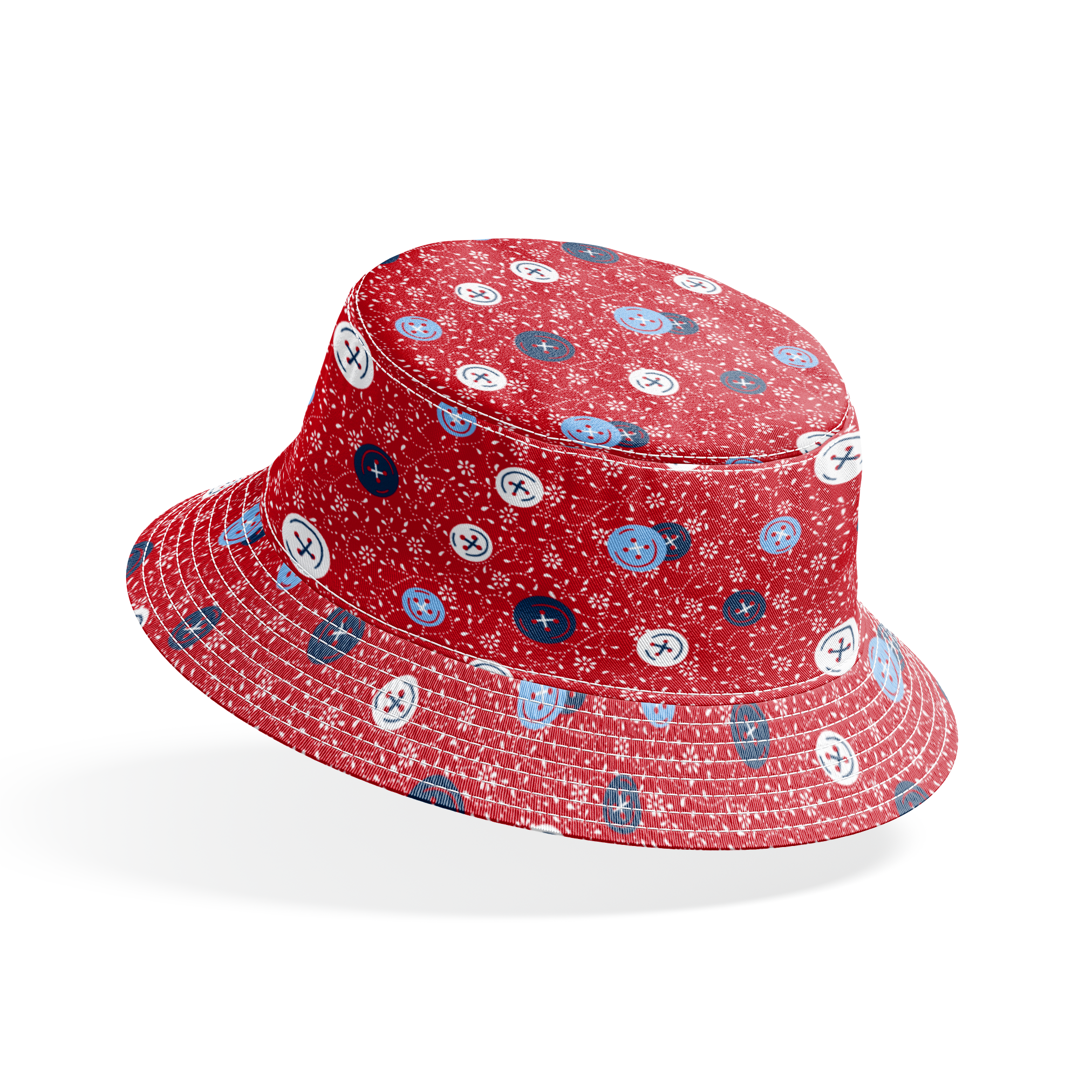 Red background with small white floral pattern featuring scattered button designs in blue, white, and navy cross details bucket hat mockup