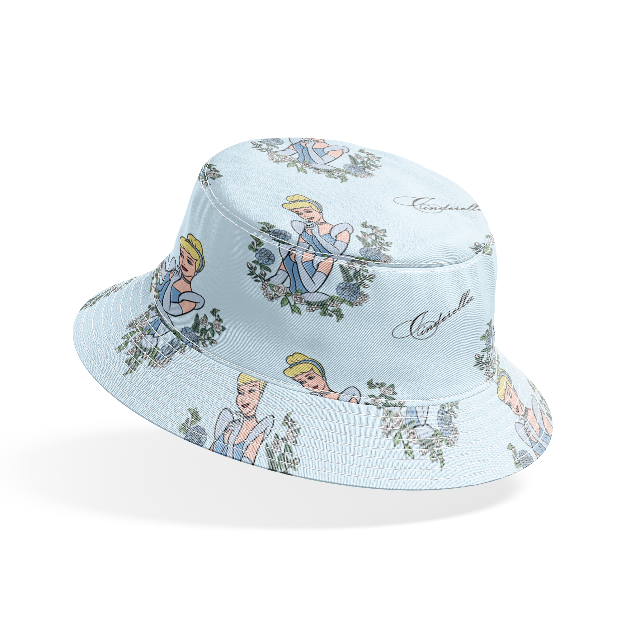The image shows a pattern featuring a cartoon princess character in a blue dress surrounded by decorative green wreaths on a light blue background. The word "Cinderella" appears in cursive script throughout the design. bucket hat mockup