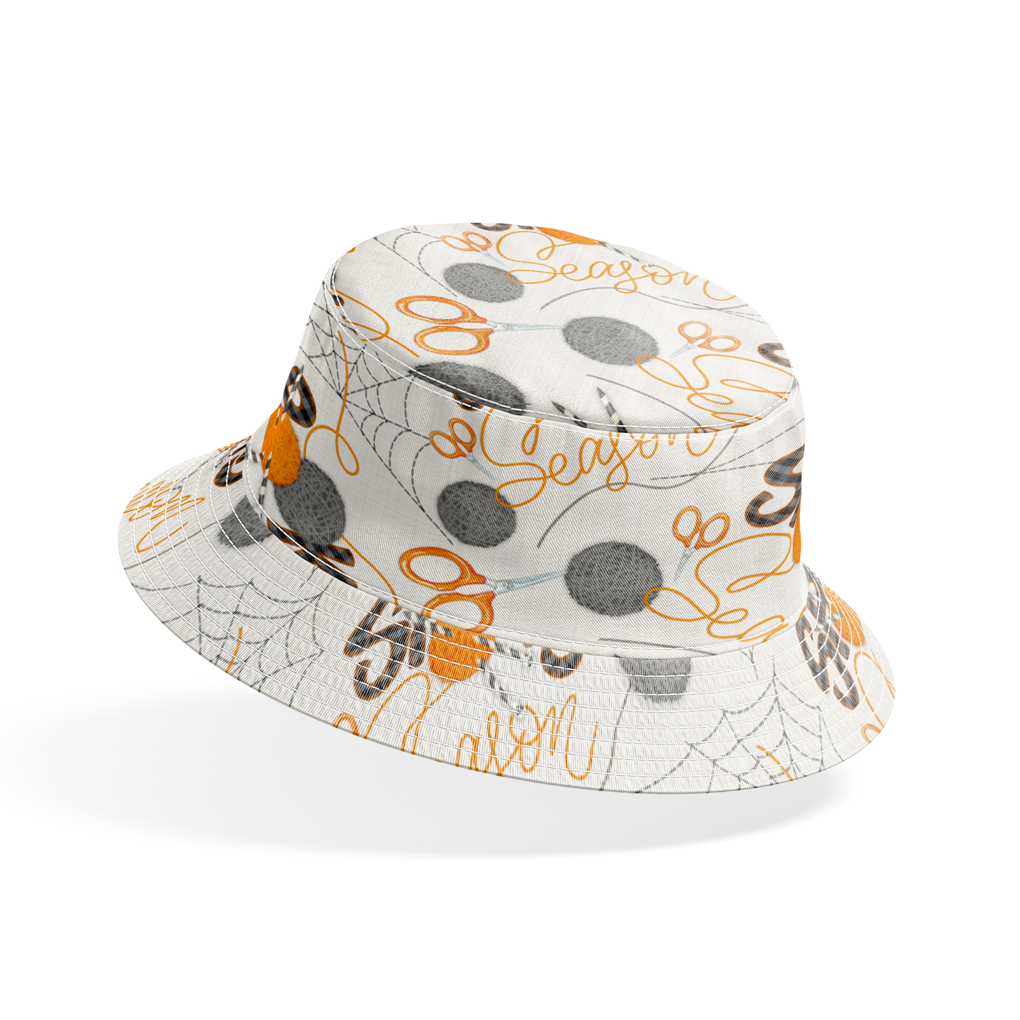 Halloween design by Nicole Tamarin featuring orange and gray yarn balls, scissors, spiderwebs, and “Spooky Season” lettering on a cream background. bucket hat mockup