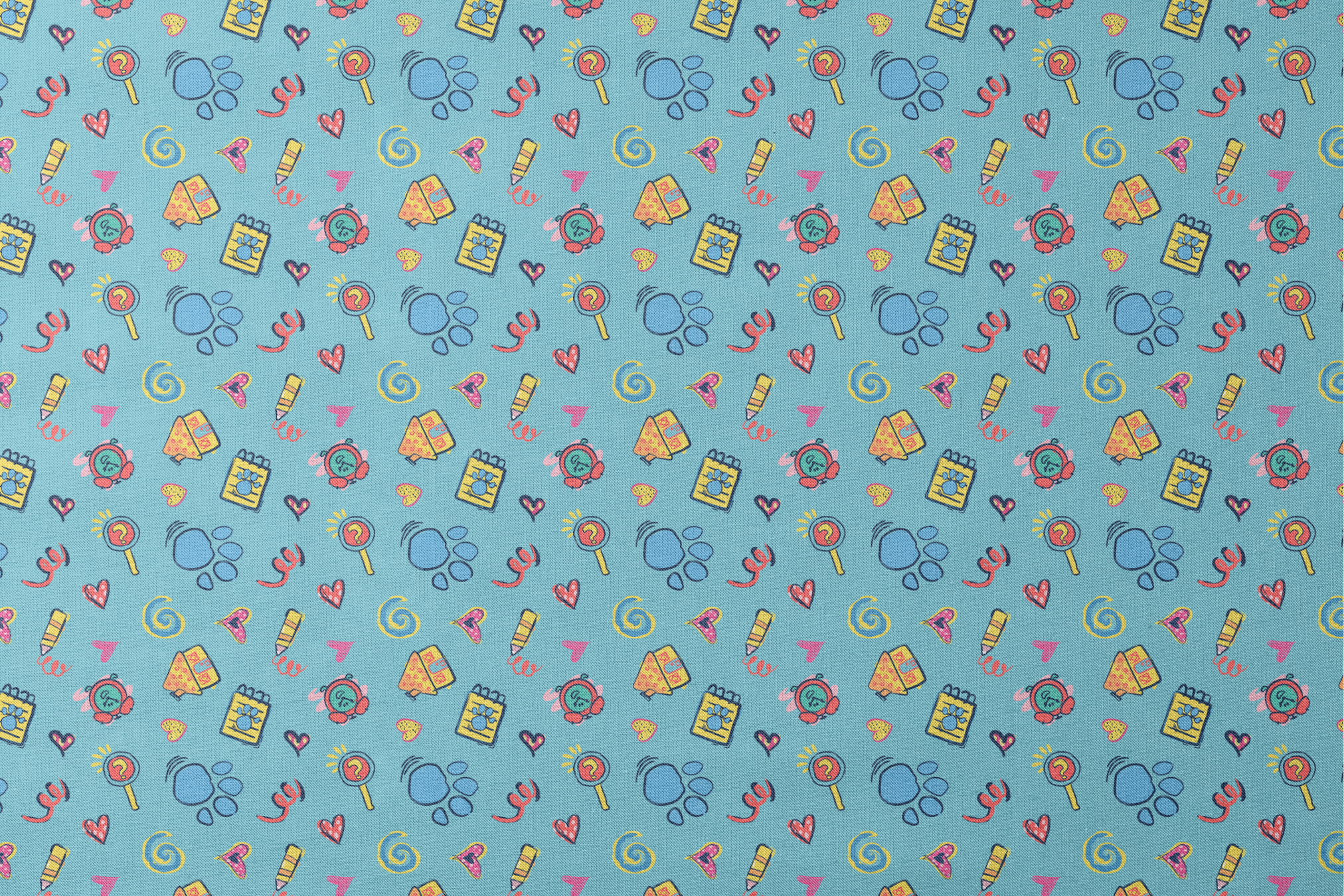 Blue’s Clues doodle-style pattern featuring paw prints, a crayon, spiral notebook, hearts, and magnifying glass on a light blue background. designs flat mockup