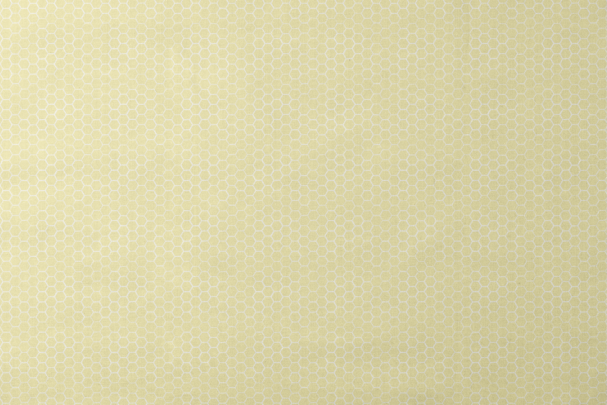 Yellow and white honeycomb pattern fabric designed by Nicole Tamarin with a soft geometric style perfect for bright, cheerful projects. designs flat mockup