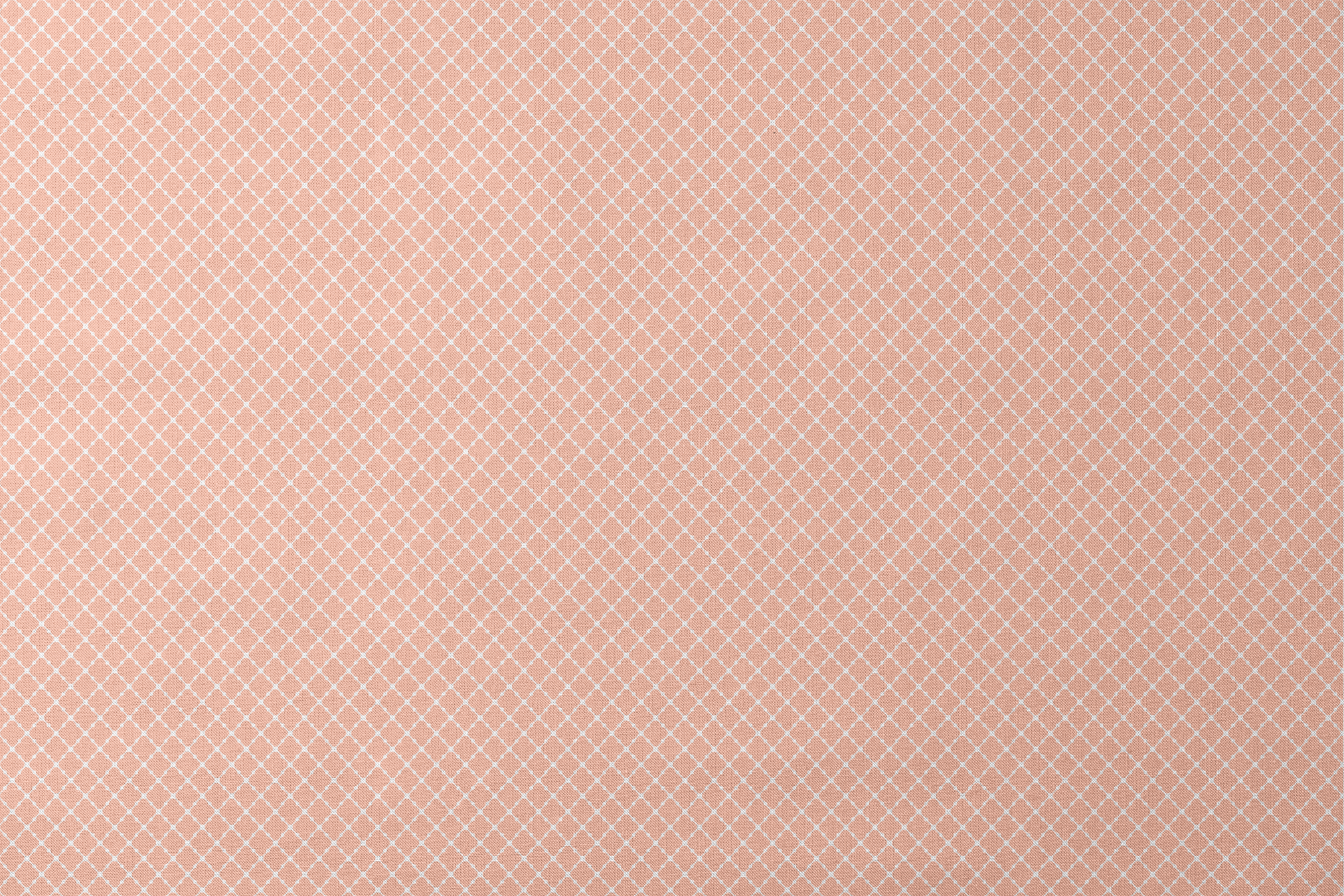 Peach and white quatrefoil pattern with regular geometric shapes in a lattice arrangement designs flat mockup