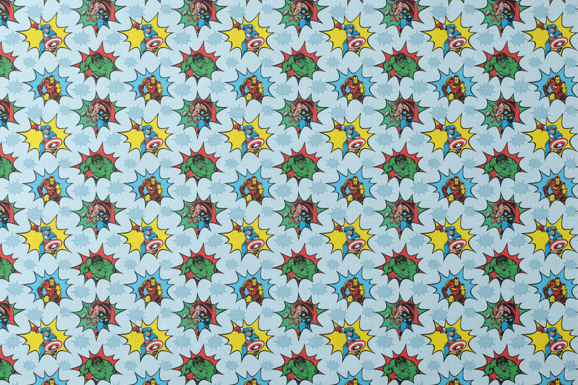 Marvel superhero pattern with Captain America, Iron Man, and Hulk in colorful burst designs on a blue background. designs flat mockup