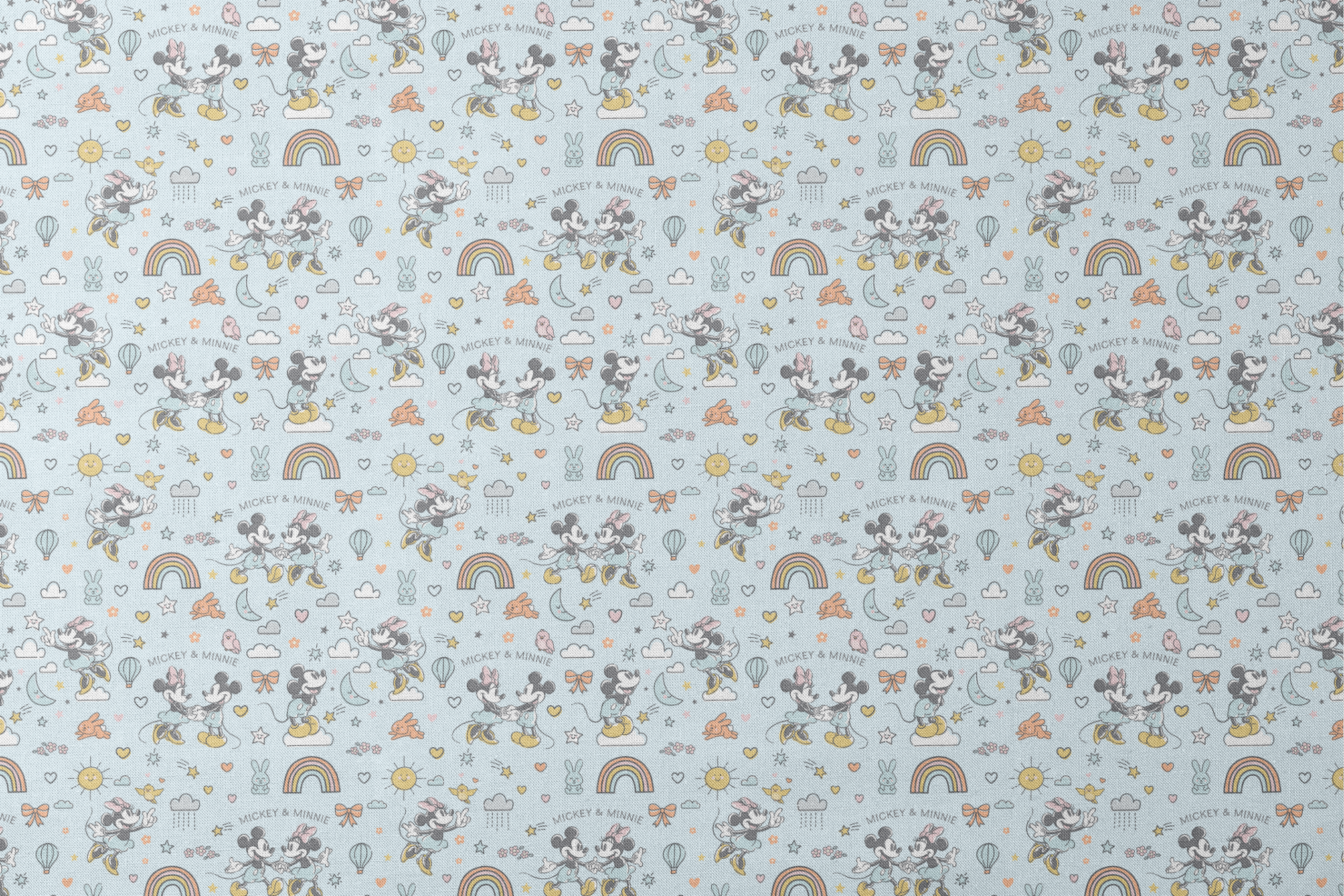 Playful Disney pattern with classic cartoon characters, rainbows, hearts, and whimsical elements on light blue background. designs flat mockup