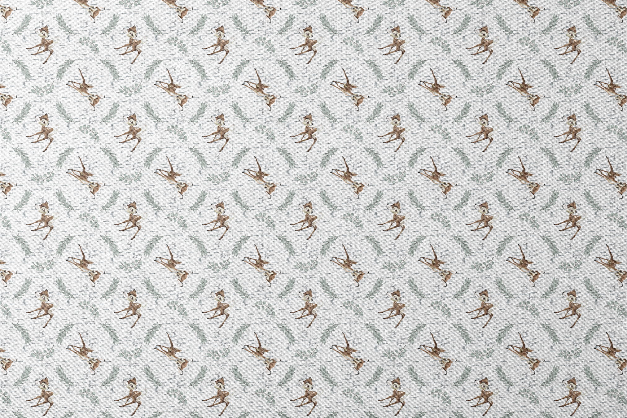 Disney’s Bambi surrounded by sage green sprigs, leafy branches, and birch bark textures on a white background in a woodland-themed scattered repeat. designs flat mockup