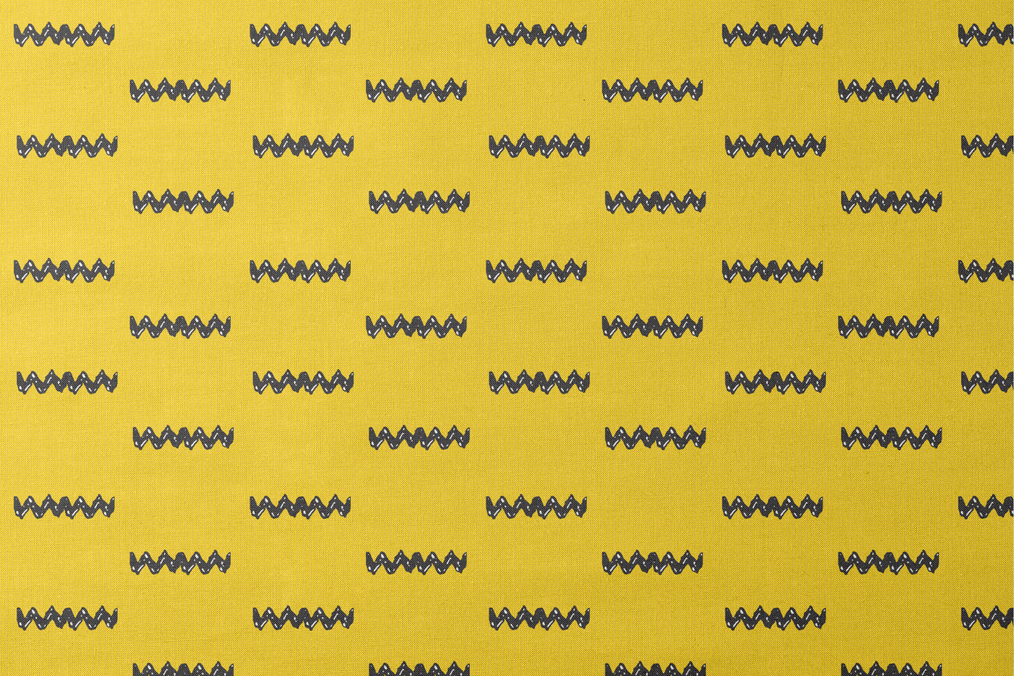 Black Charlie Brown zigzag patterns arranged in four rows against a bright yellow textured background designs flat mockup