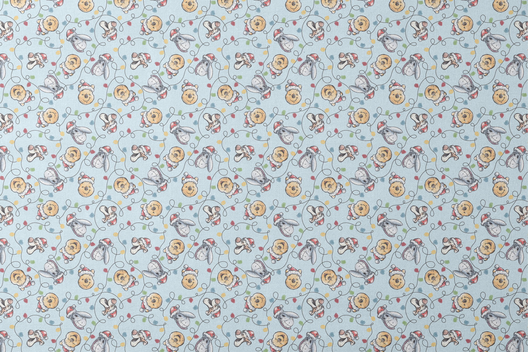 Winnie the Pooh Christmas pattern with Pooh bear, Eeyore, and Tigger in Santa hats on blue background designs flat mockup