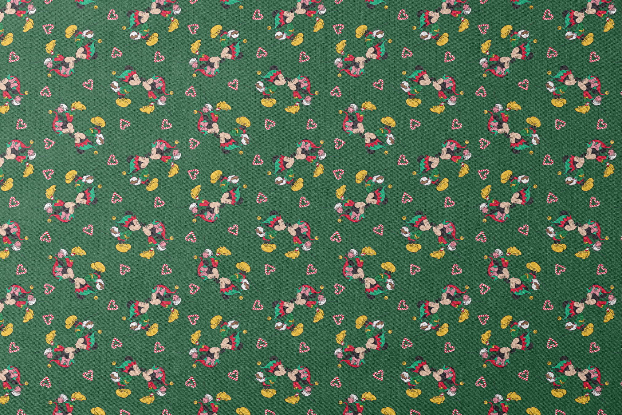 Festive Mickey Mouse pattern with candy canes on green background designs flat mockup