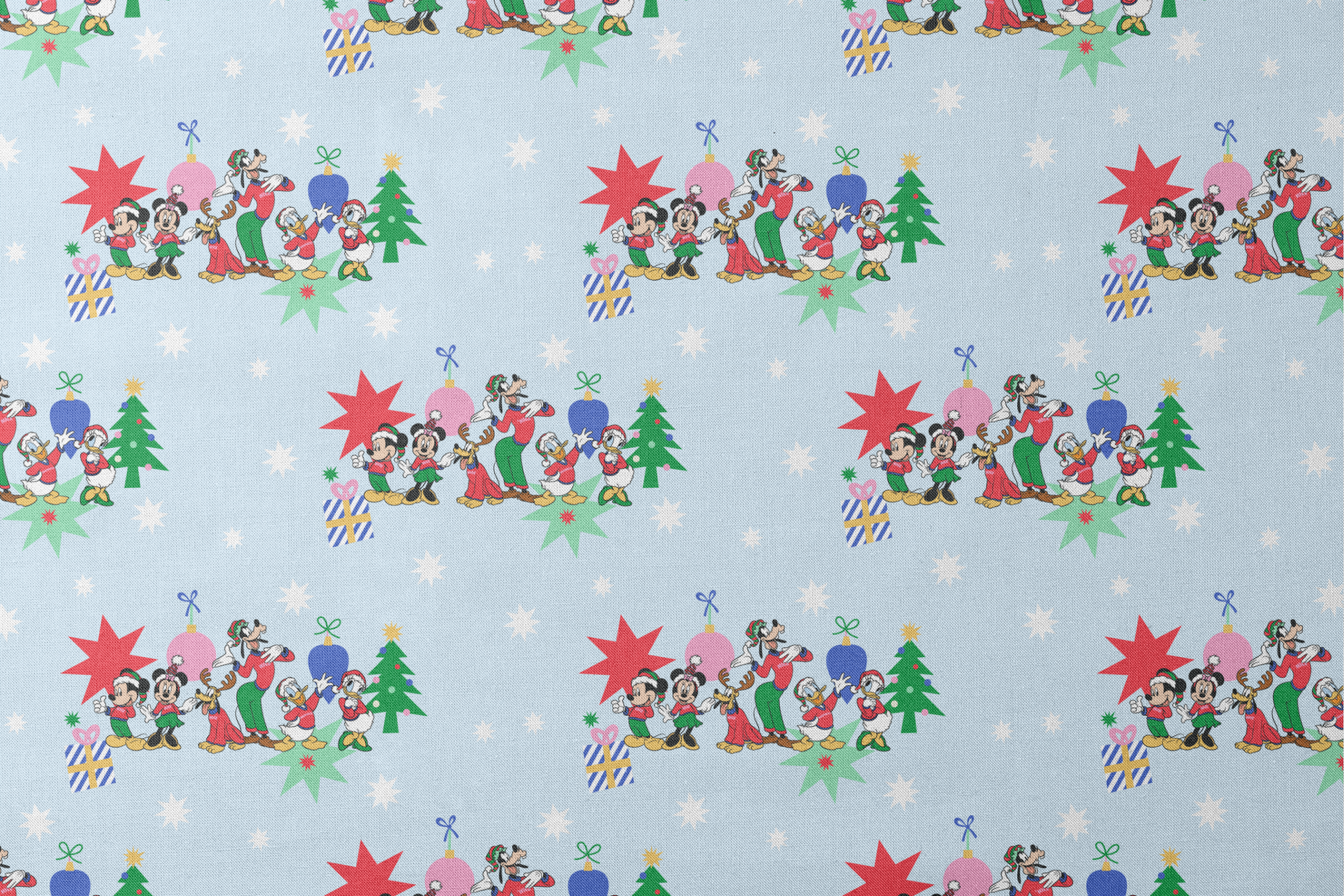 Cartoon Disney characters in festive poses with Christmas trees, ornaments, and stars on light blue snowy background designs flat mockup