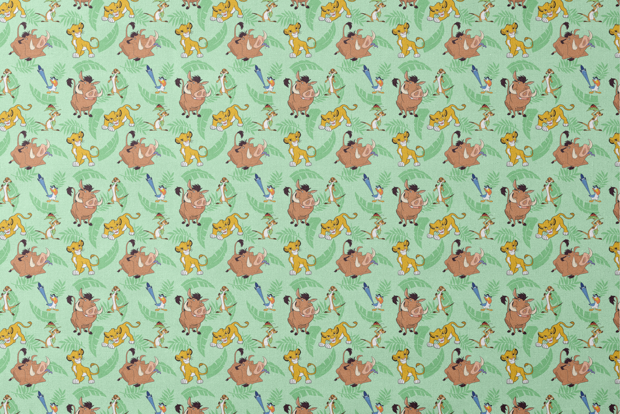 A repeating pattern of Lion King characters - Simba, Timon, Pumbaa, and Zazu on a light green leafy background. designs flat mockup