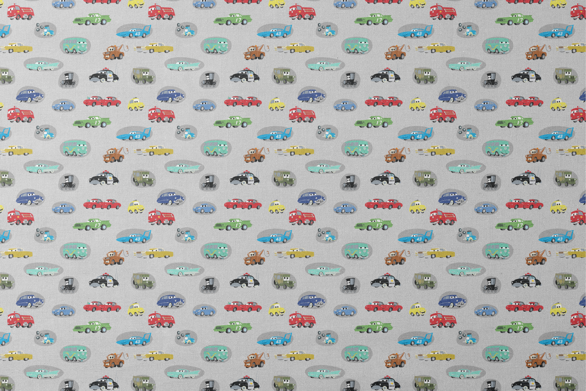 Various cartoon toy cars and vehicles in different colors (red, blue, green, yellow) displayed against a gray background with cute animated faces. designs flat mockup