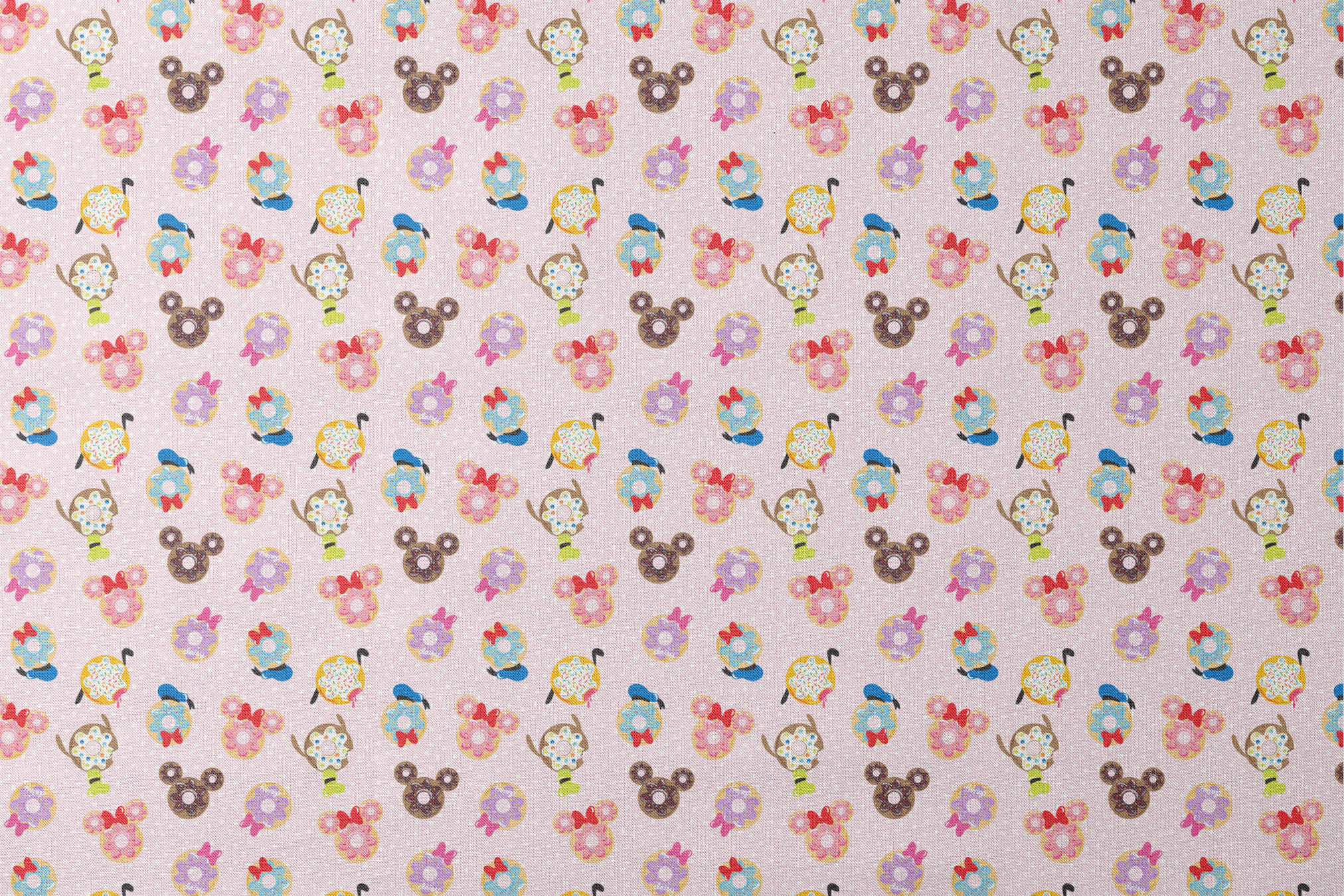 Mickey Mouse & friends donuts in various shapes on a pink polka dot background. designs flat mockup