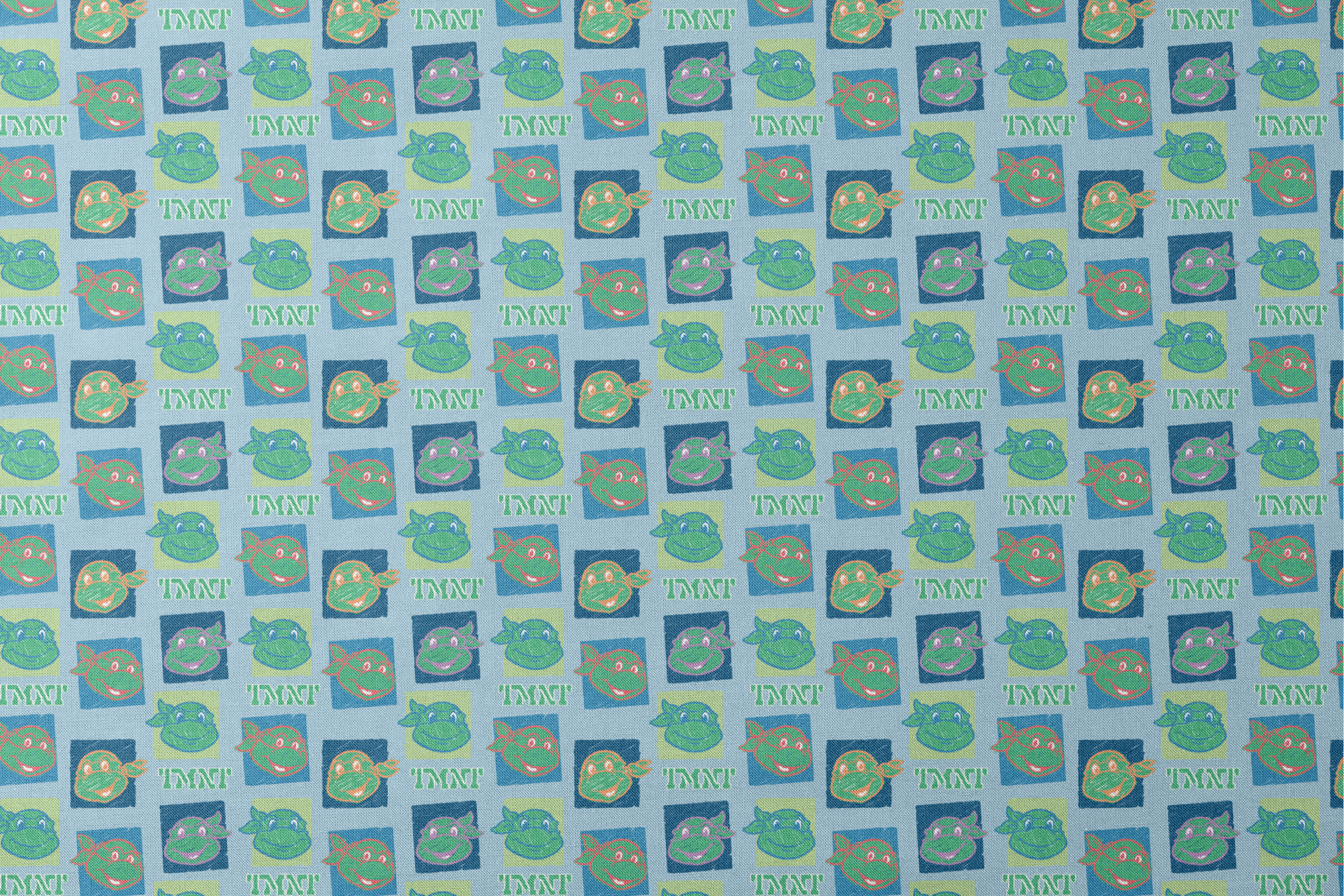 Teenage Mutant Ninja Turtles pattern with cartoon turtle faces in squares on light blue background designs flat mockup