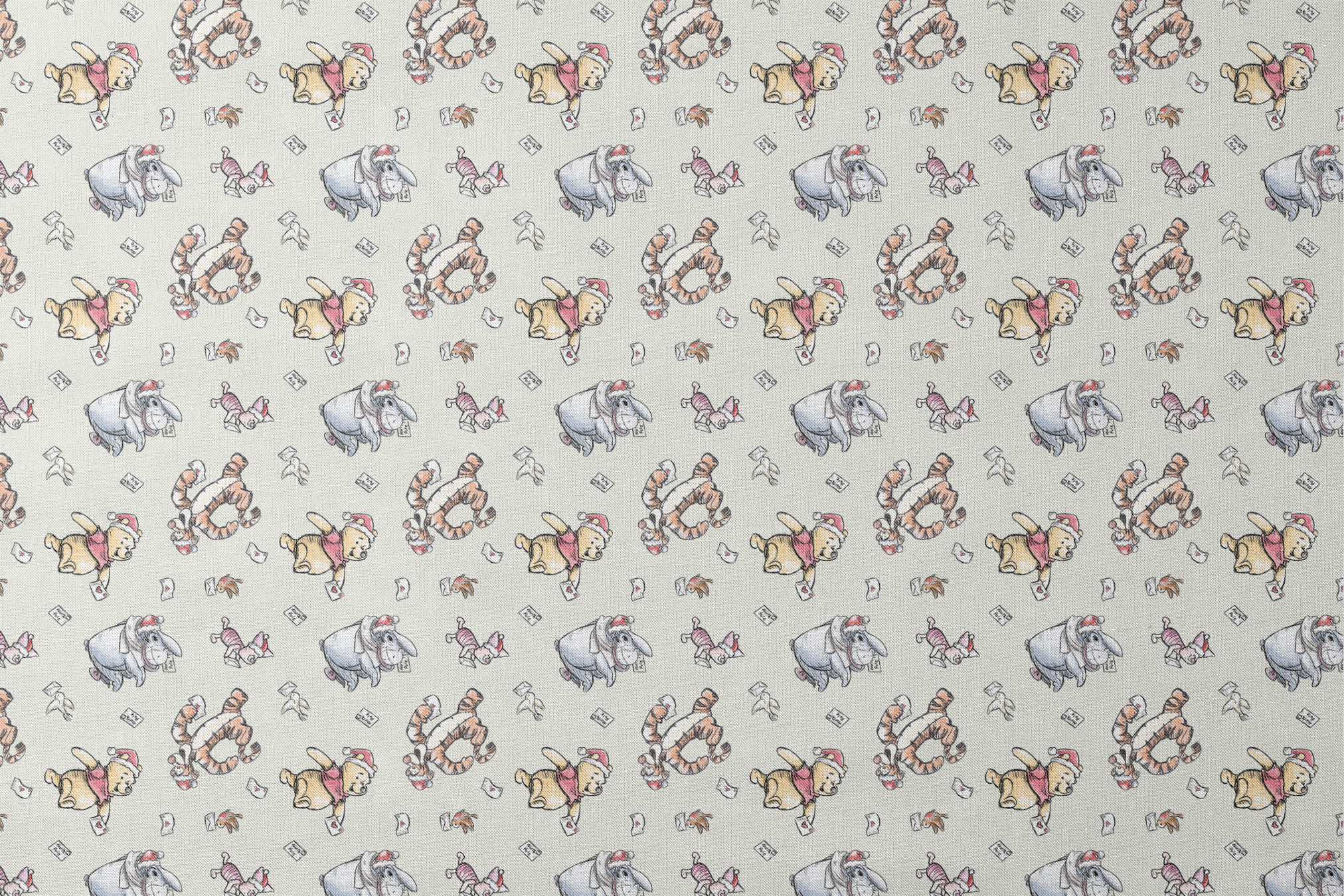 Whimsical cartoon characters in Santa hats on cream background with scattered letters designs flat mockup