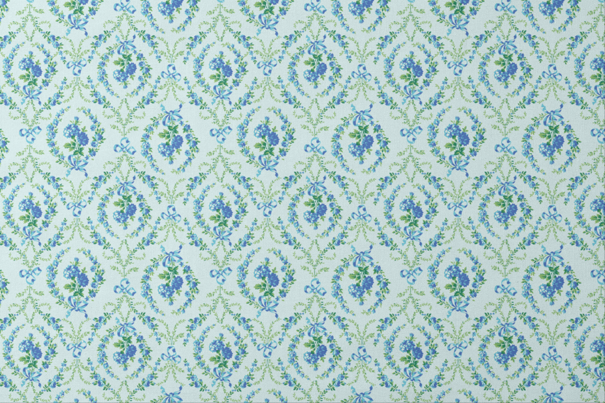 Blue floral pattern with diamond lattice design featuring delicate ribbons and green foliage on light background designs flat mockup