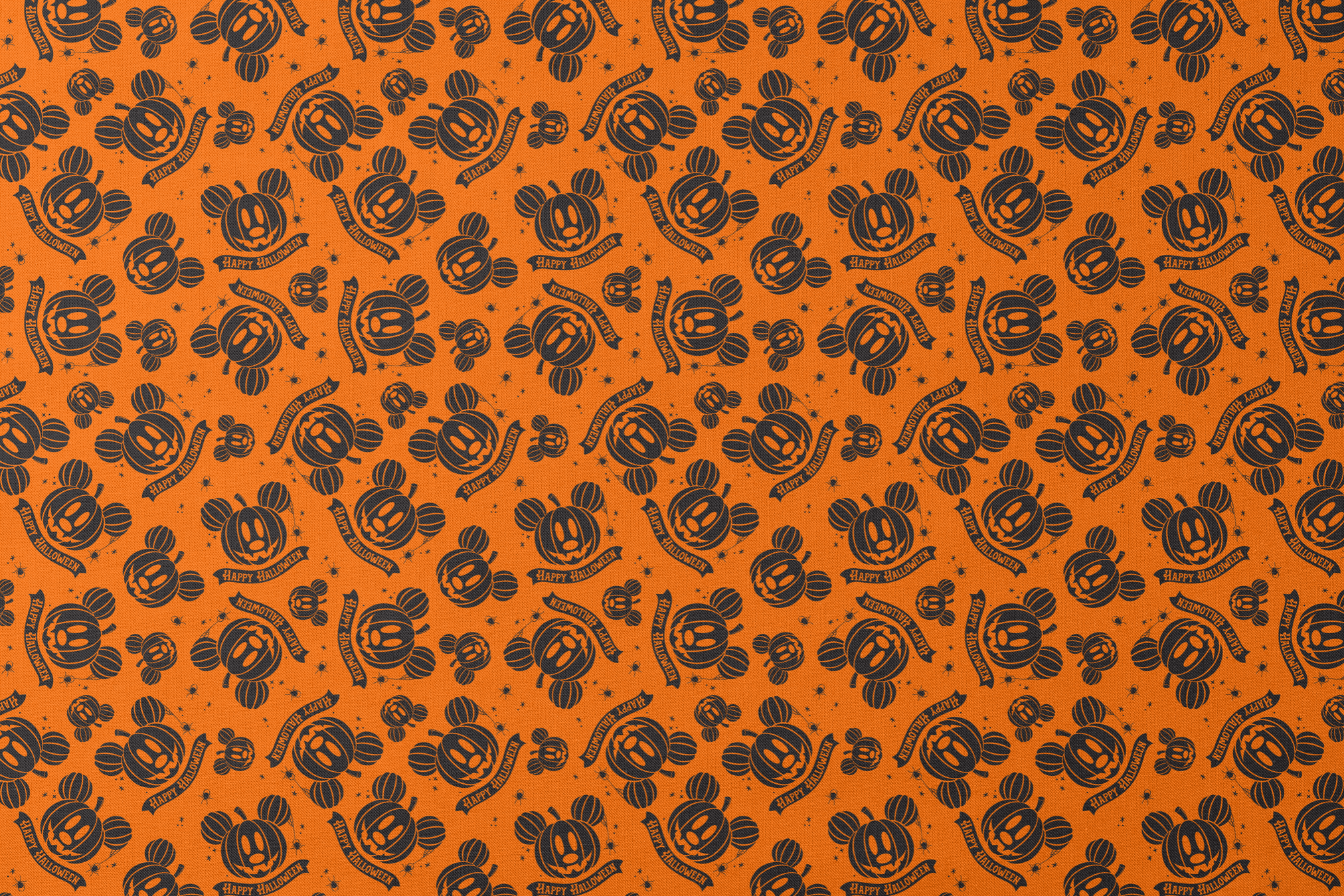 Halloween pattern with Disney-inspired jack-o'-lantern pumpkins and "Happy Halloween" text on bright orange background designs flat mockup