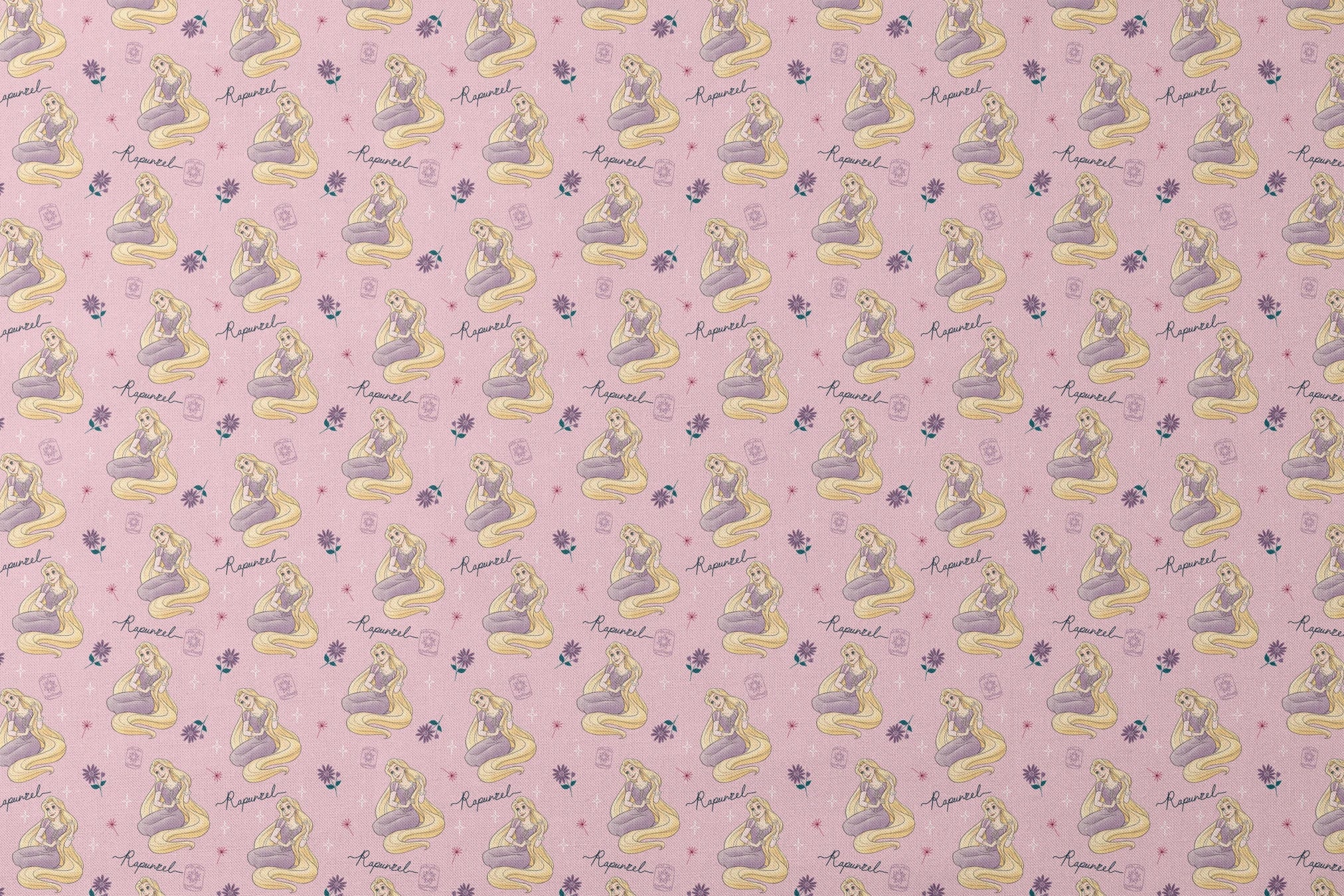Repeating pattern of blonde character in purple dress with long flowing hair, flowers, and "Rapunzel" text on pink background designs flat mockup