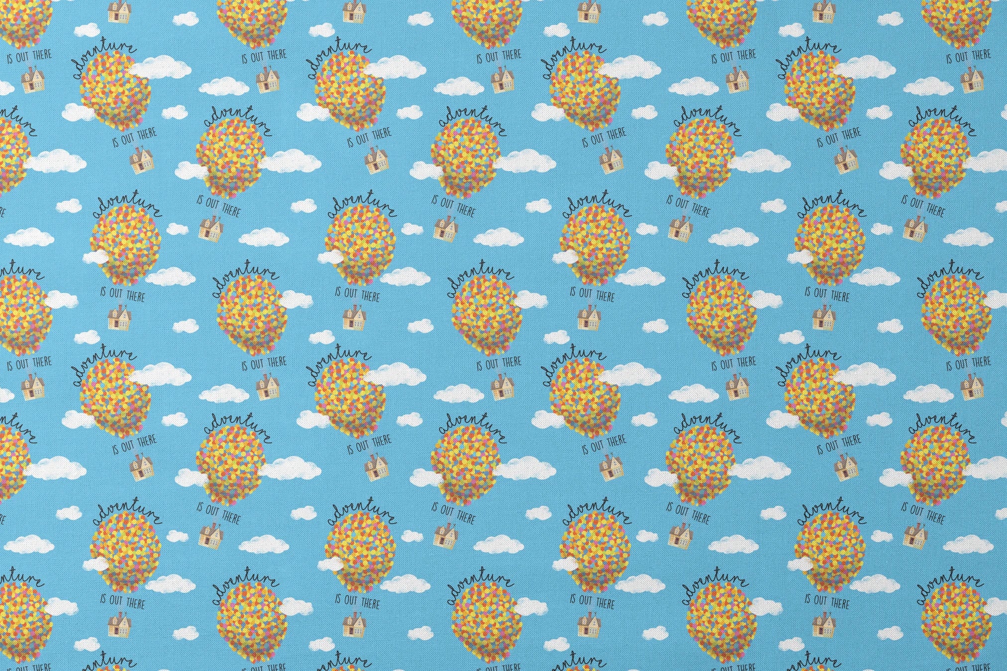 Colorful Up-inspired balloon houses floating in blue sky with text "Adventure is out there" repeating in pattern designs flat mockup