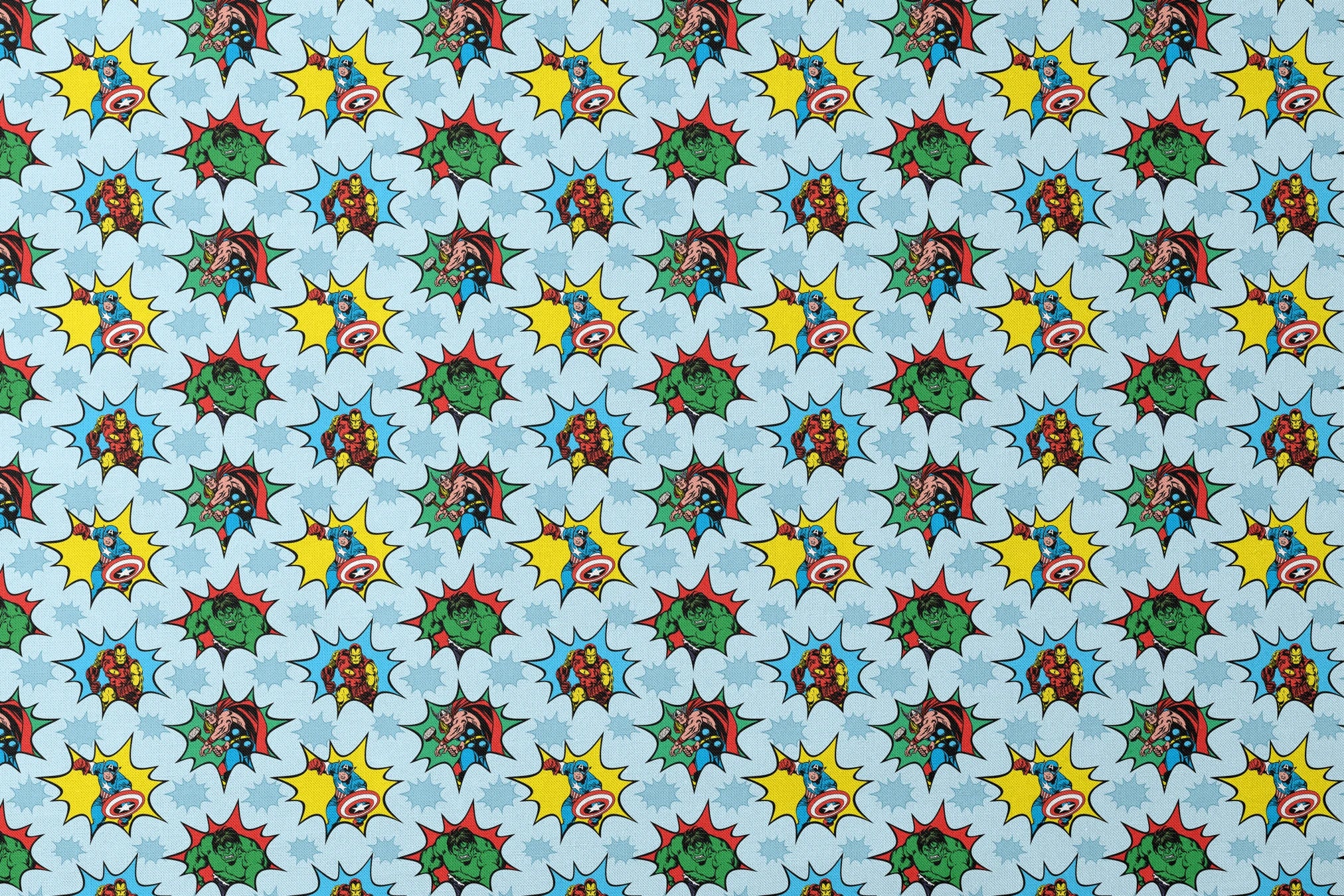 Marvel superhero pattern with Captain America, Iron Man, and Hulk in colorful burst designs on a blue background. designs flat mockup