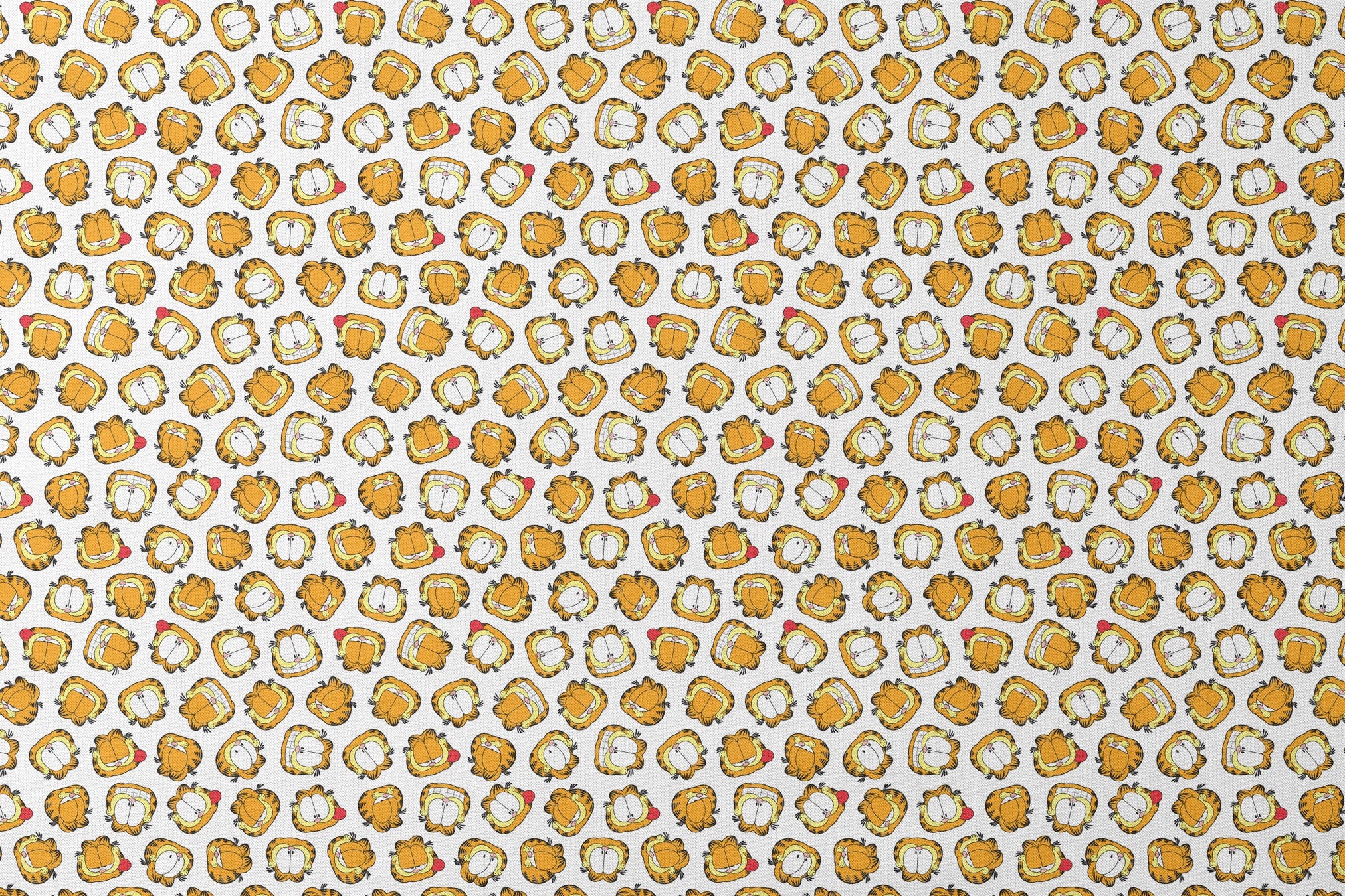Pattern of cartoon cat faces with orange and yellow coloring against white background designs flat mockup