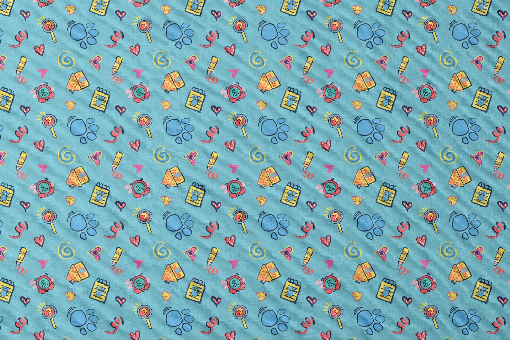 Blue’s Clues doodle-style pattern featuring paw prints, a crayon, spiral notebook, hearts, and magnifying glass on a light blue background. designs flat mockup