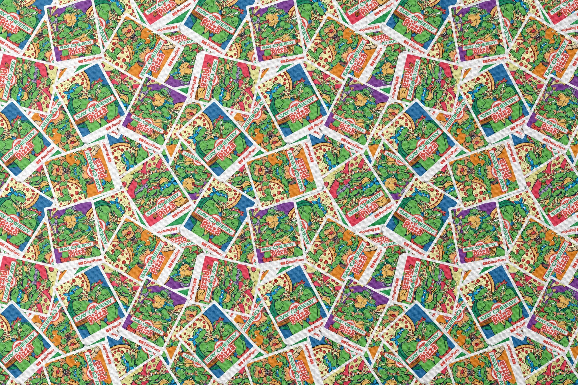 Scattered vintage Teenage Mutant Ninja Turtles trading cards with colorful comic-style artwork designs flat mockup