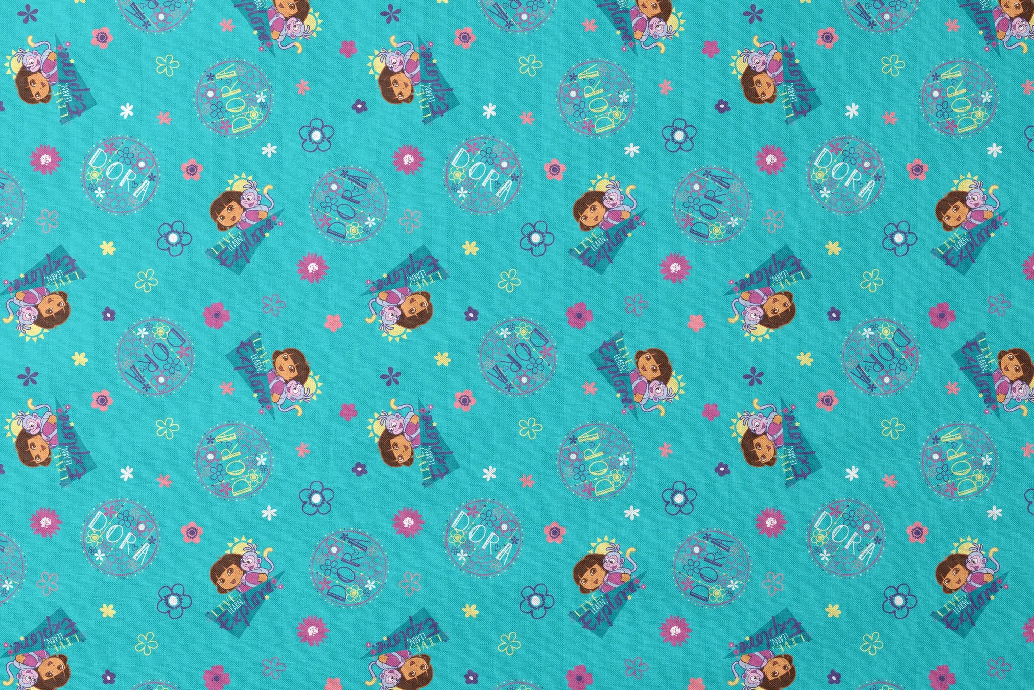 Colorful teal pattern with Dora the Explorer characters, decorative circles, flowers, and triangular shapes in pink, purple, and blue designs flat mockup