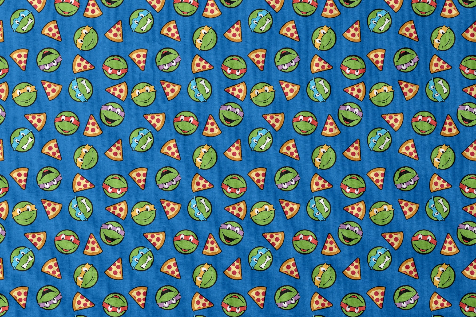 Teenage Mutant Ninja Turtle faces with colored masks and pizza slices pattern on blue background designs flat mockup