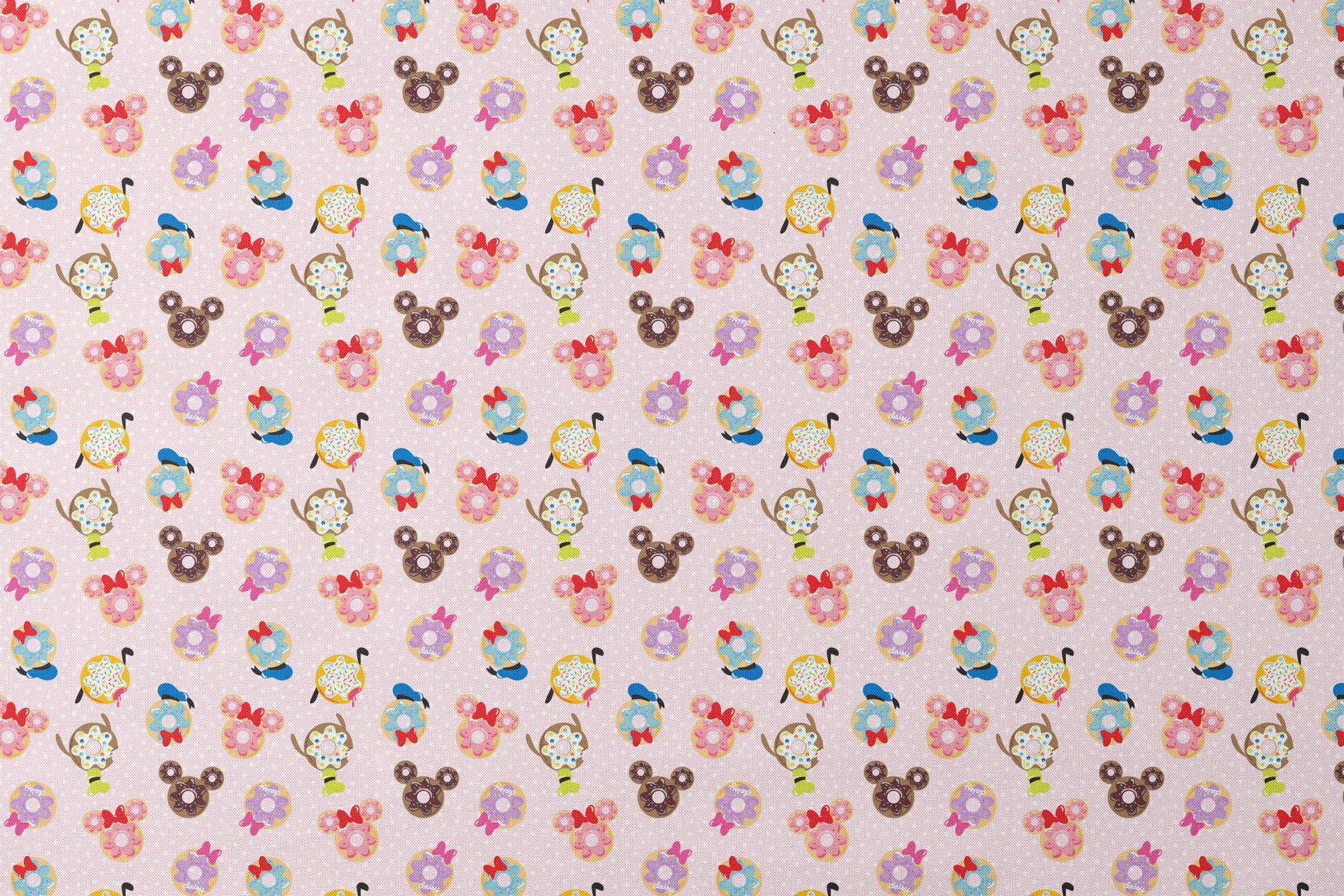 Mickey Mouse & friends donuts in various shapes on a pink polka dot background. designs flat mockup