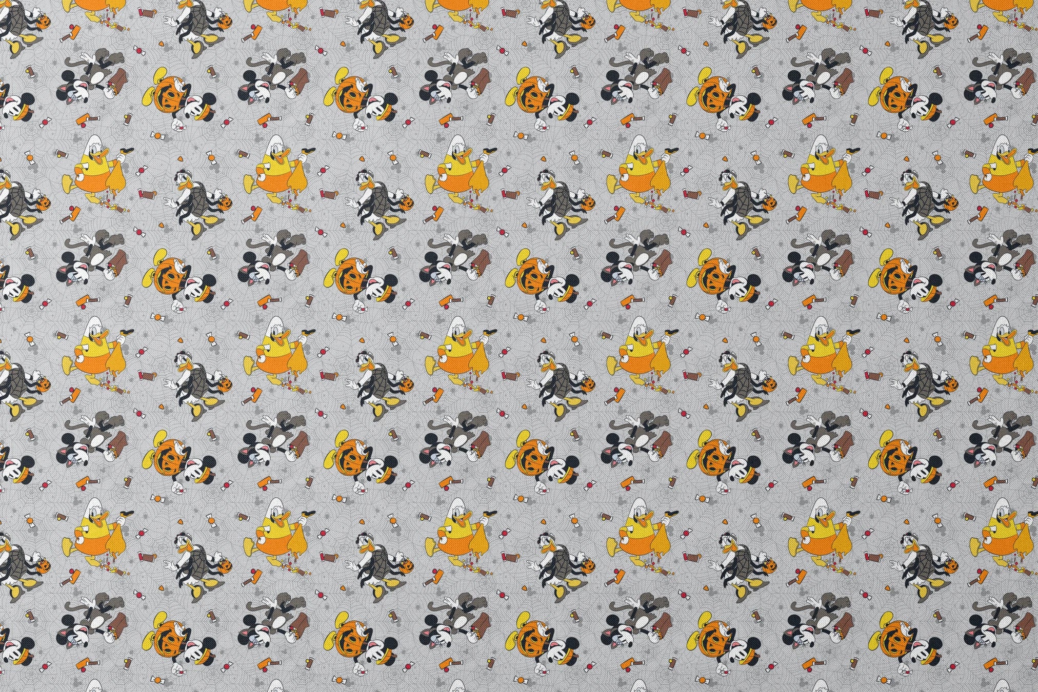 Disney characters on gray spider web pattern with candy corn scattered throughout, Halloween themed design. designs flat mockup