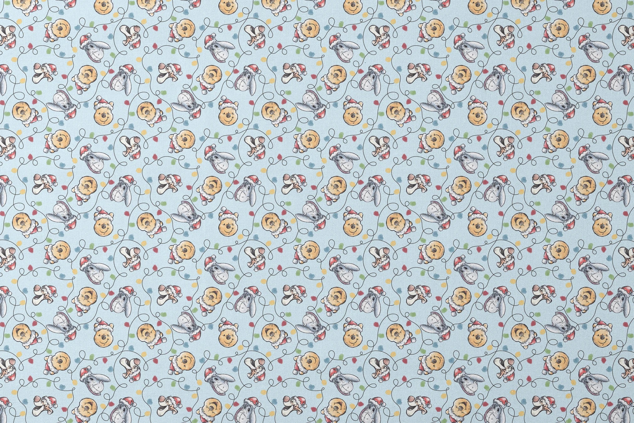 Winnie the Pooh Christmas pattern with Pooh bear, Eeyore, and Tigger in Santa hats on blue background designs flat mockup