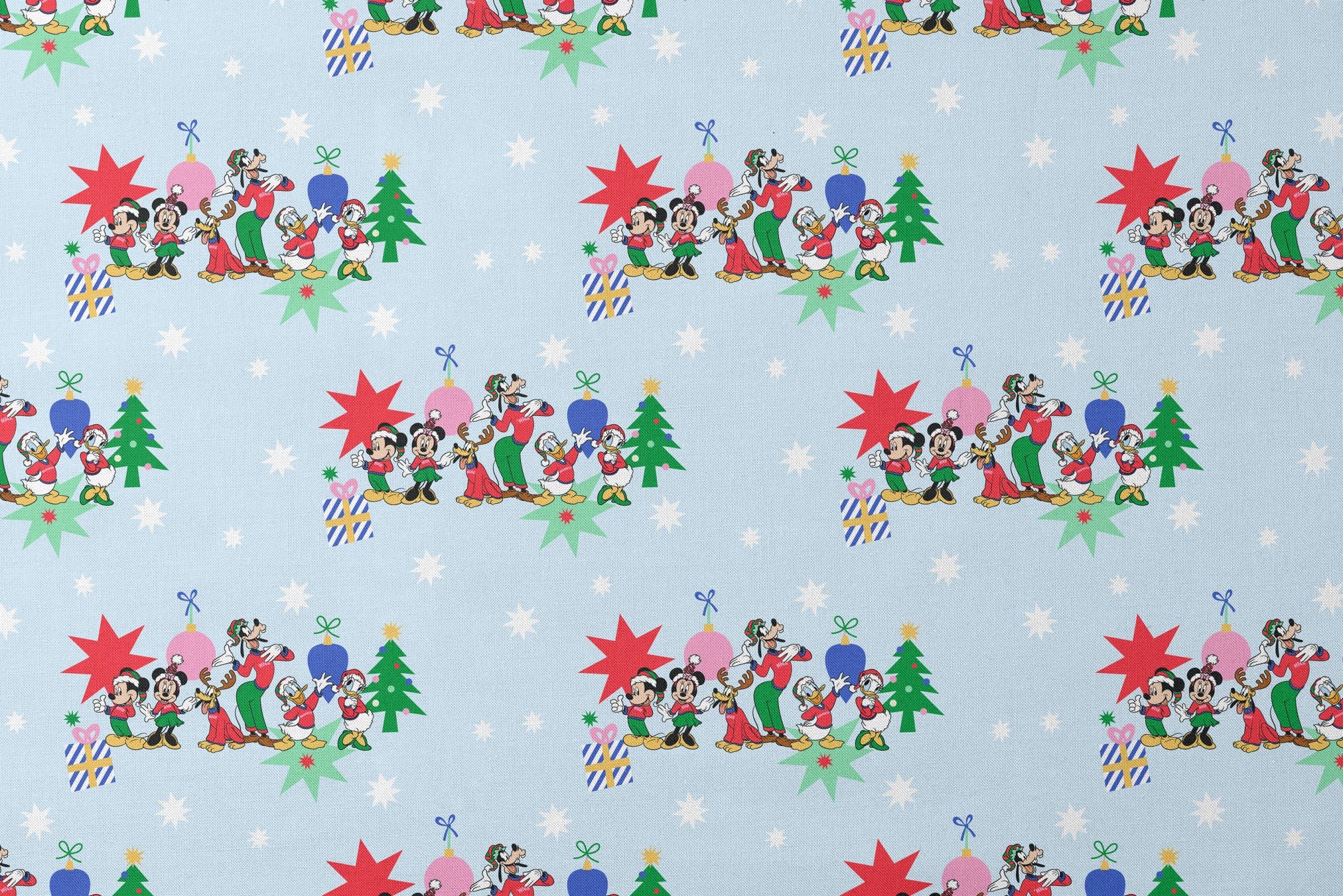 Cartoon Disney characters in festive poses with Christmas trees, ornaments, and stars on light blue snowy background designs flat mockup