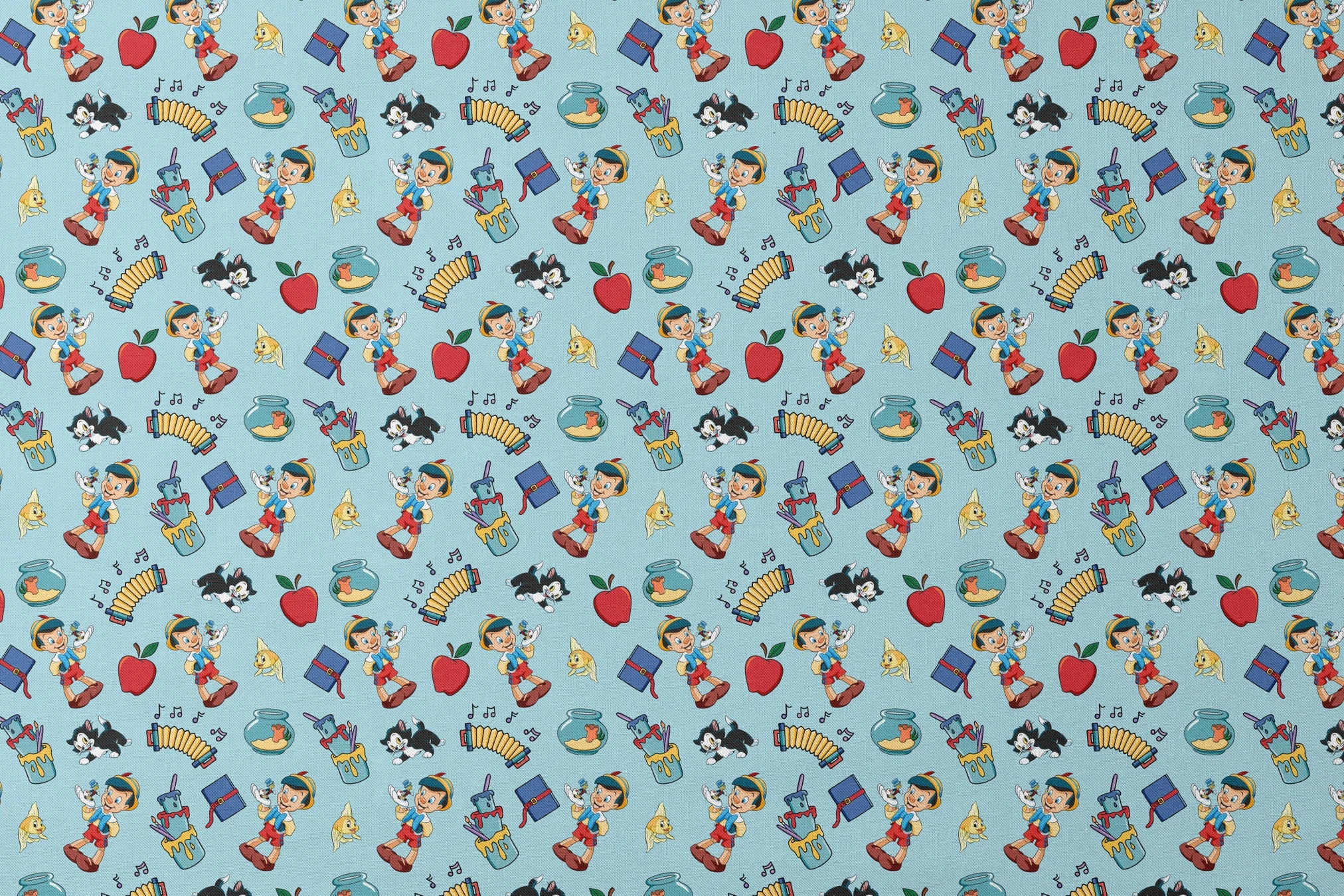 Cartoon pattern with wooden puppets, red apples, musical notes, goldfish bowls, cats, and books on light blue background designs flat mockup