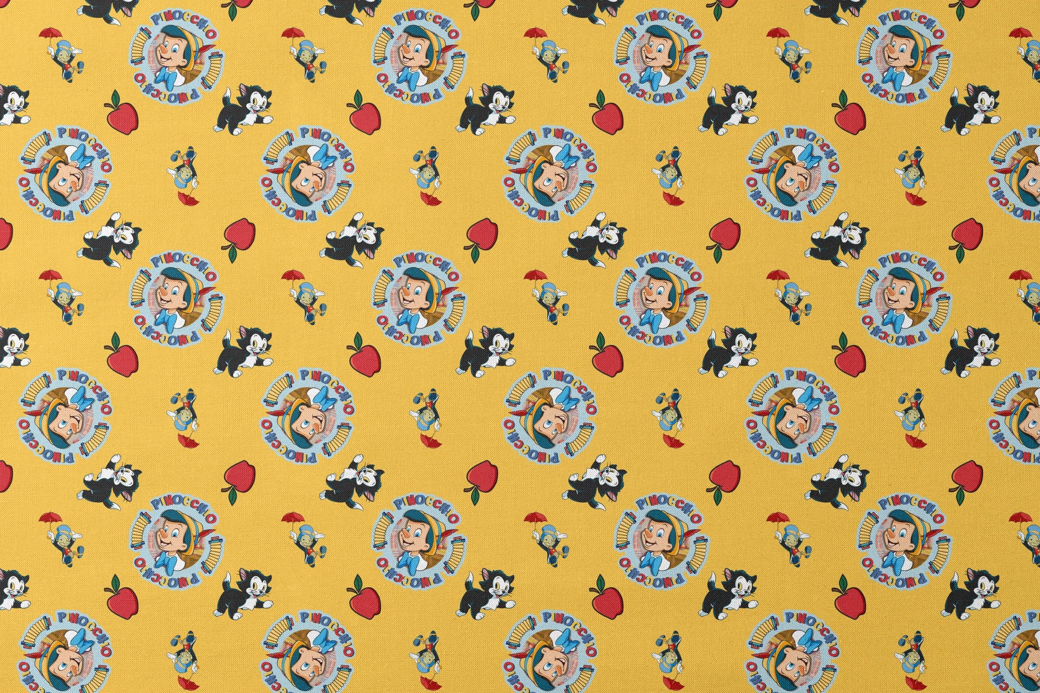 Pinocchio and Disney character pattern on yellow background with circular logos and red apples designs flat mockup