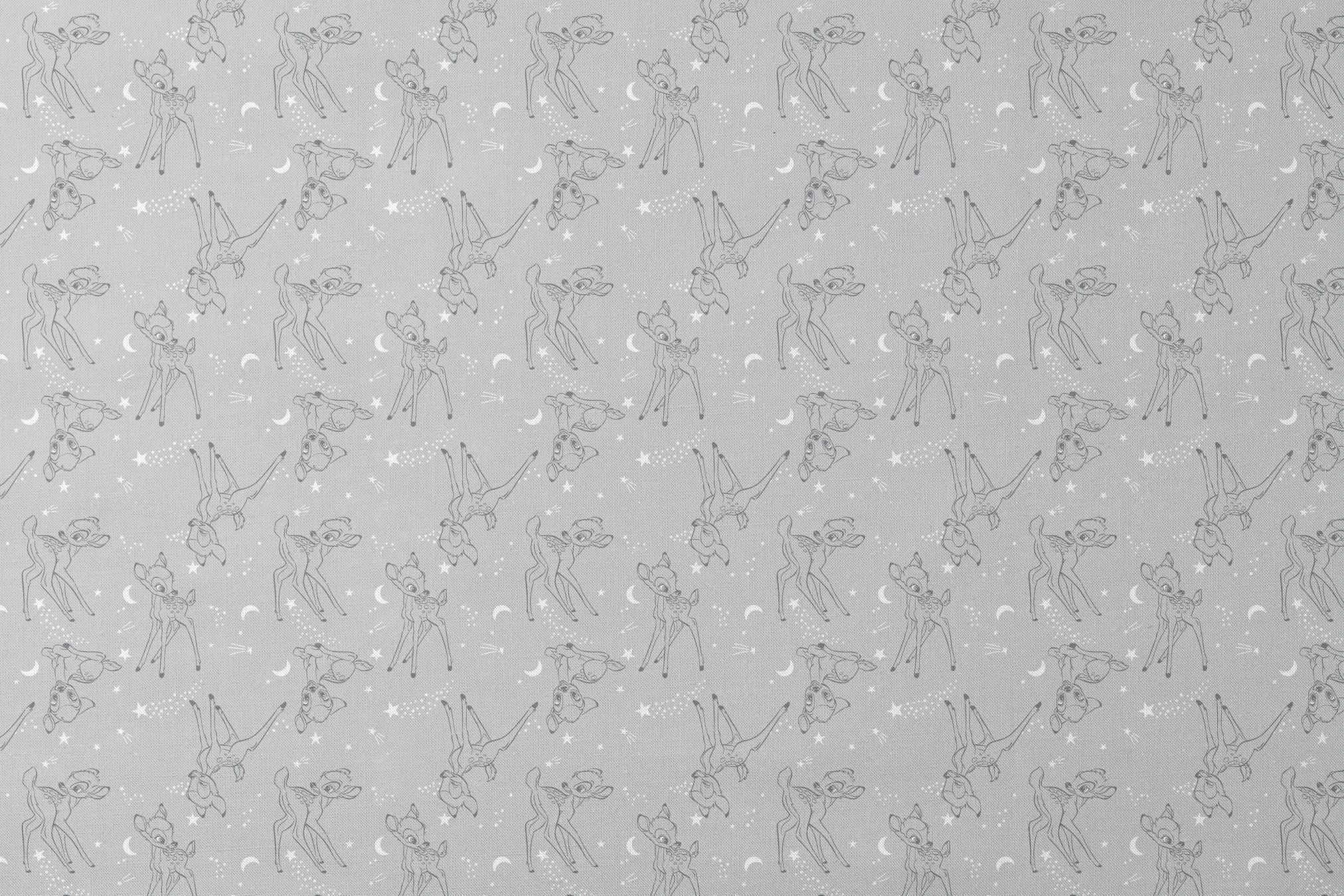 Line art illustrations of Disney’s Bambi surrounded by stars, moons, and stardust trails on a soft gray background in a scattered repeat. designs flat mockup