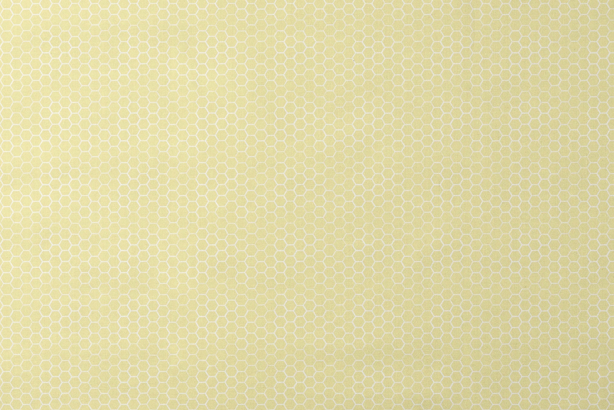 Yellow and white honeycomb pattern fabric designed by Nicole Tamarin with a soft geometric style perfect for bright, cheerful projects. designs flat mockup
