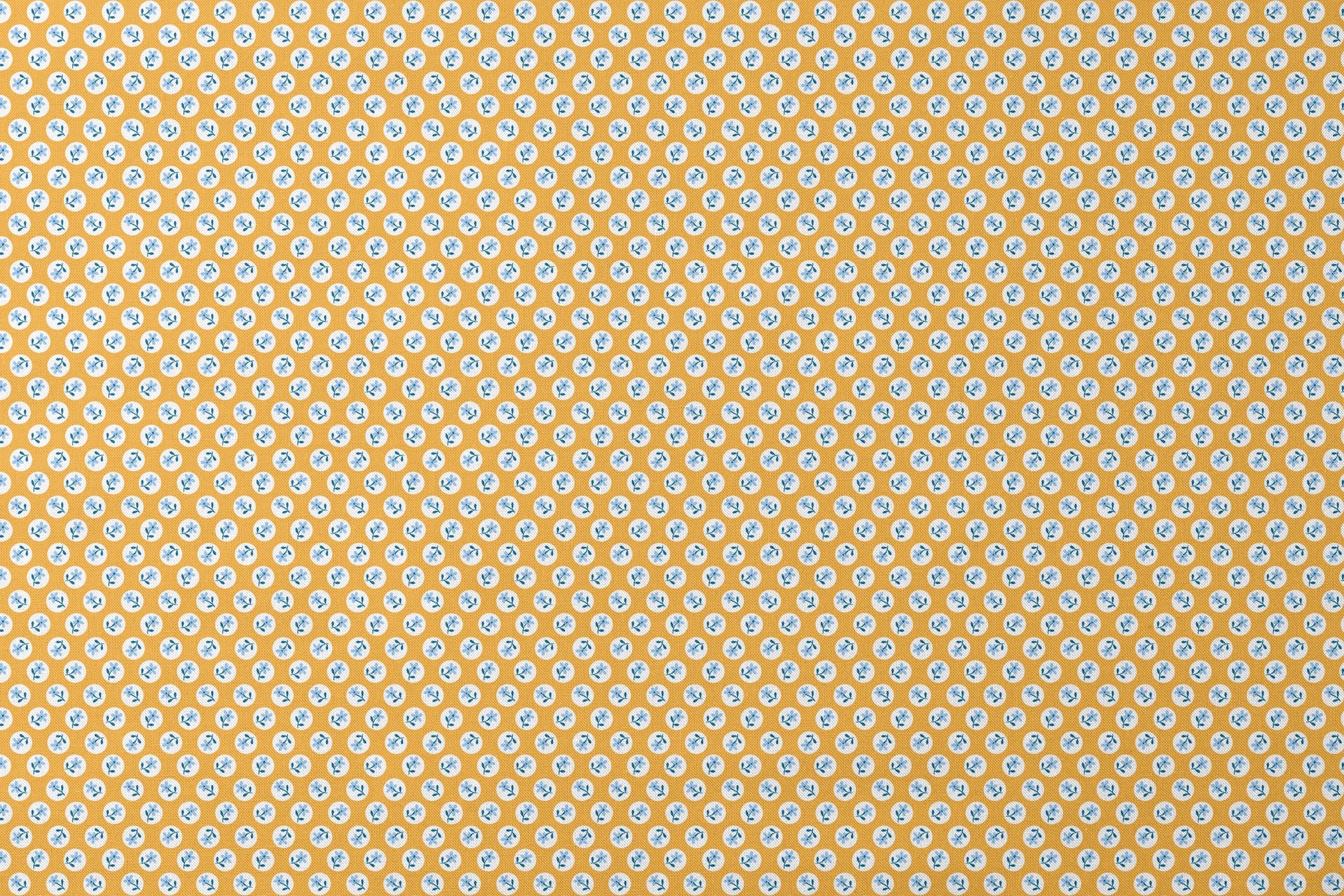 Light blue flowers with navy stems in white circles on a mustard yellow background designs flat mockup