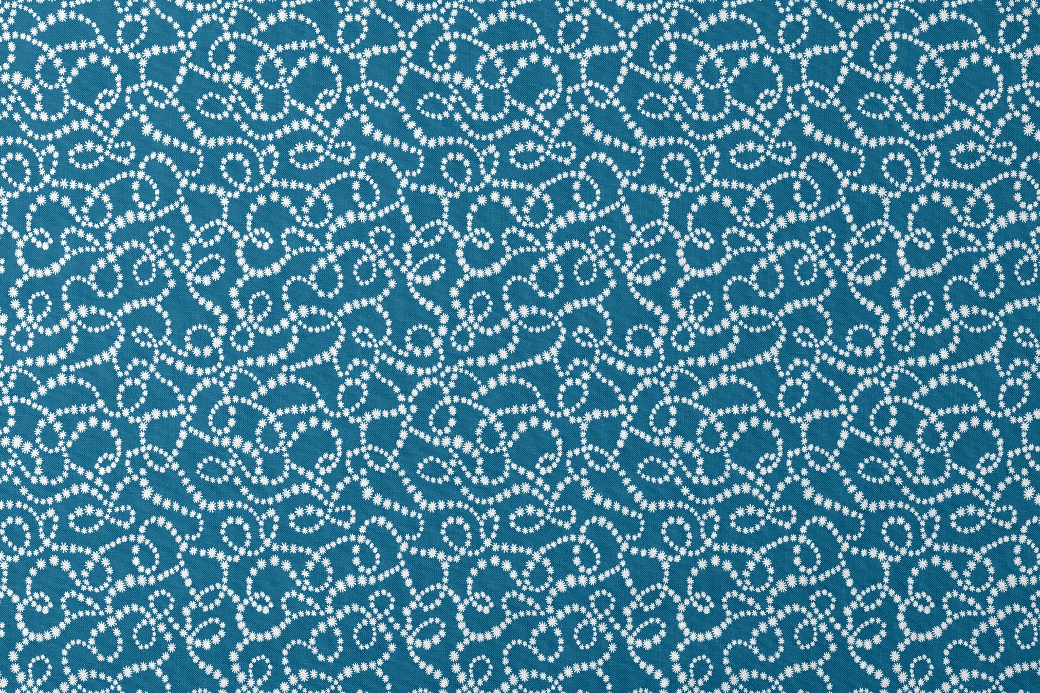 Dotted white swirling patterns on deep teal blue background creating abstract curved designs designs flat mockup