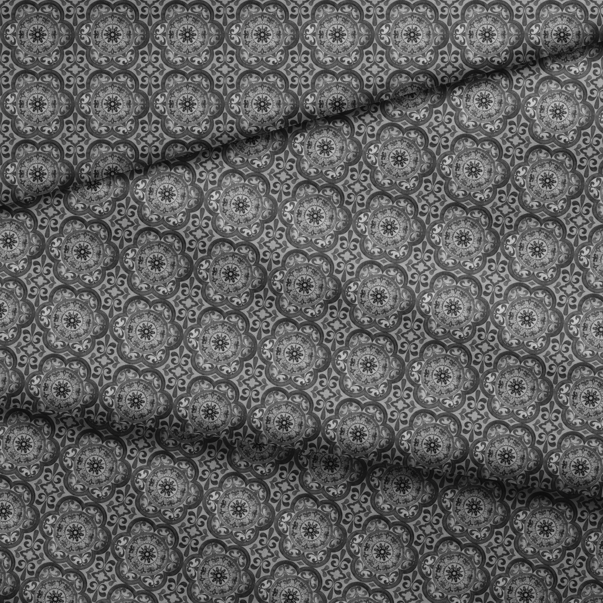 Grayscale medallion tile pattern with floral and scroll motifs in a symmetrical layout by Nicole Tamarin. fabric fold mockup