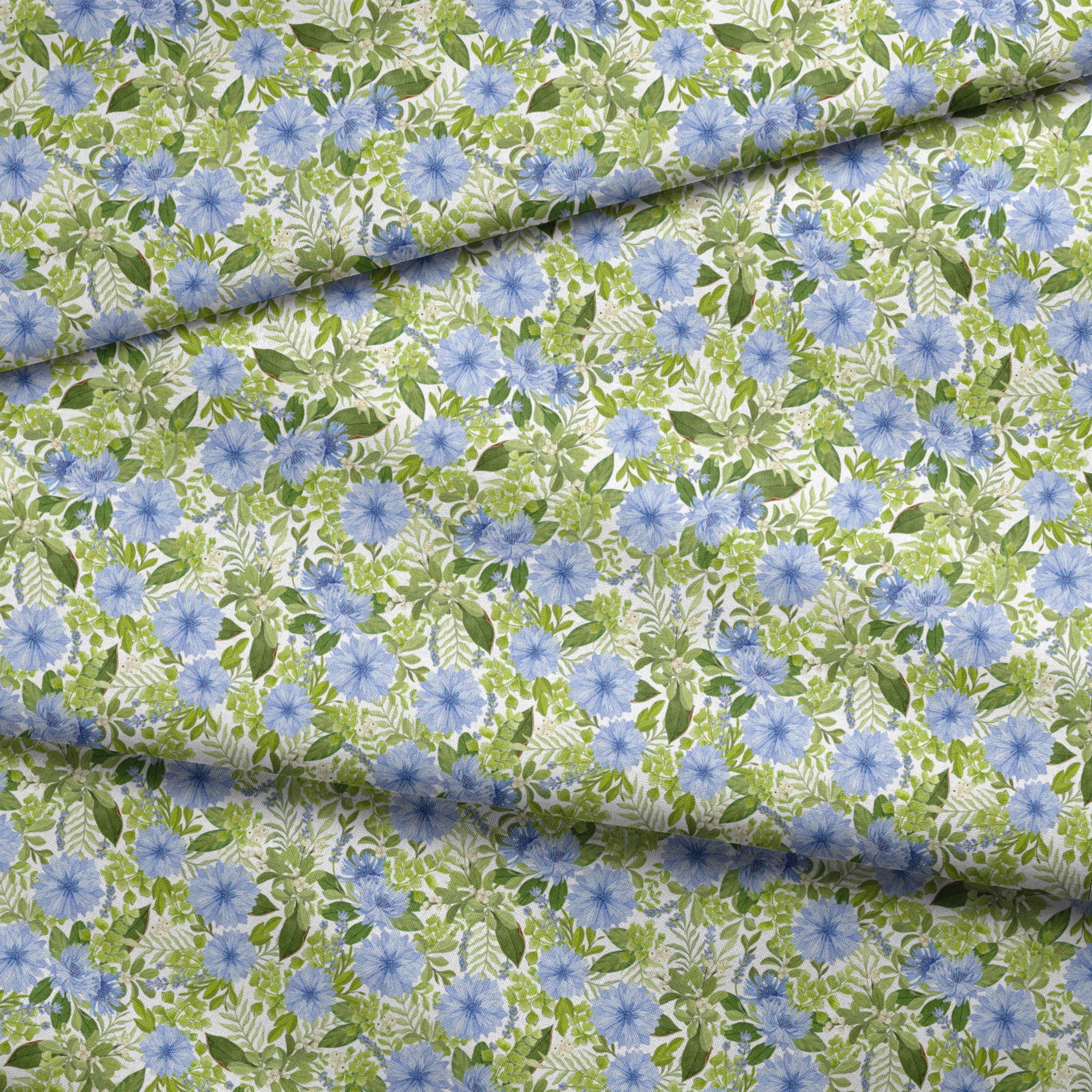 Watercolor-style botanical fabric pattern featuring blue wildflowers and soft green foliage on a white background. Designed by Nicole Tamarin. fabric fold mockup