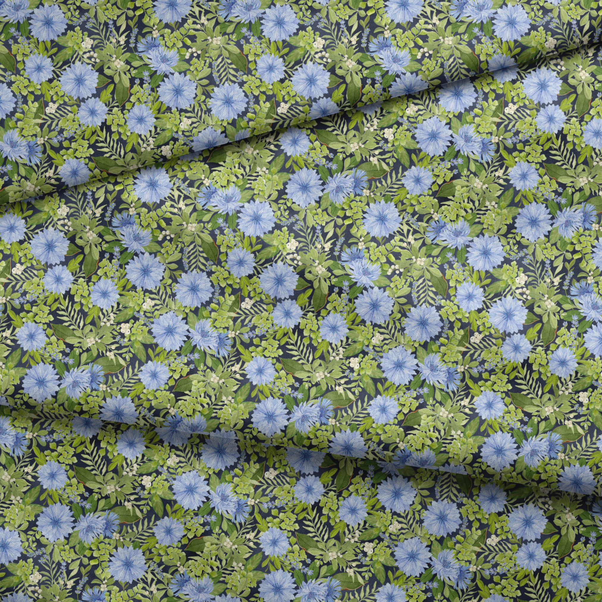 Beautiful floral pattern with light blue cornflowers and vibrant green leaves and foliage fabric fold mockup