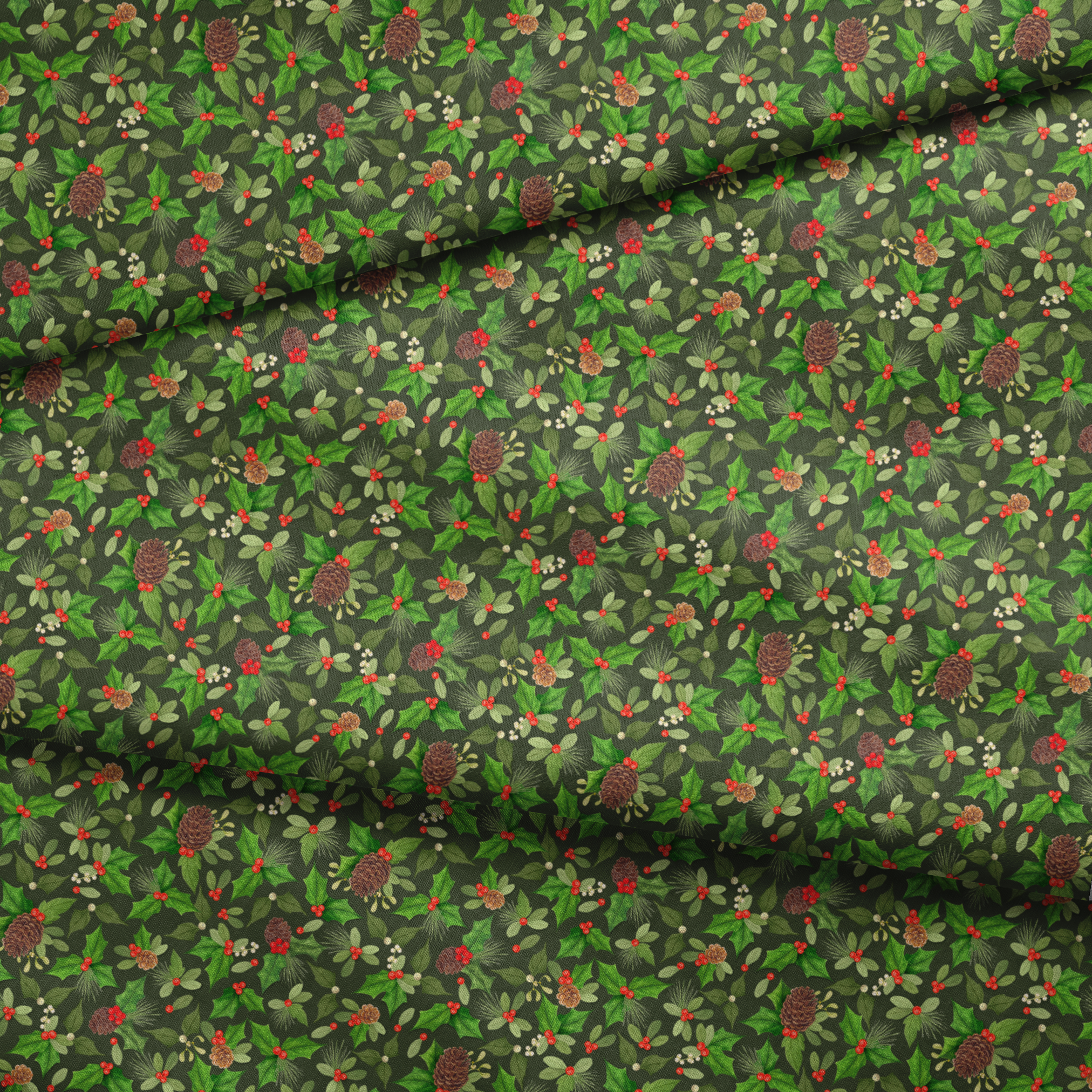 Seamless holiday pattern by Nicole Tamarin featuring pinecones, holly, red berries, and green foliage on a dark green background. fabric fold mockup