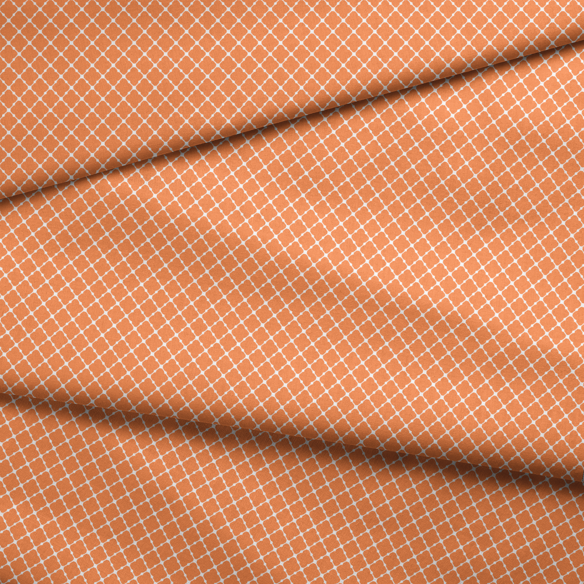 Geometric orange and white pattern with quatrefoil shapes forming a lattice design fabric fold mockup