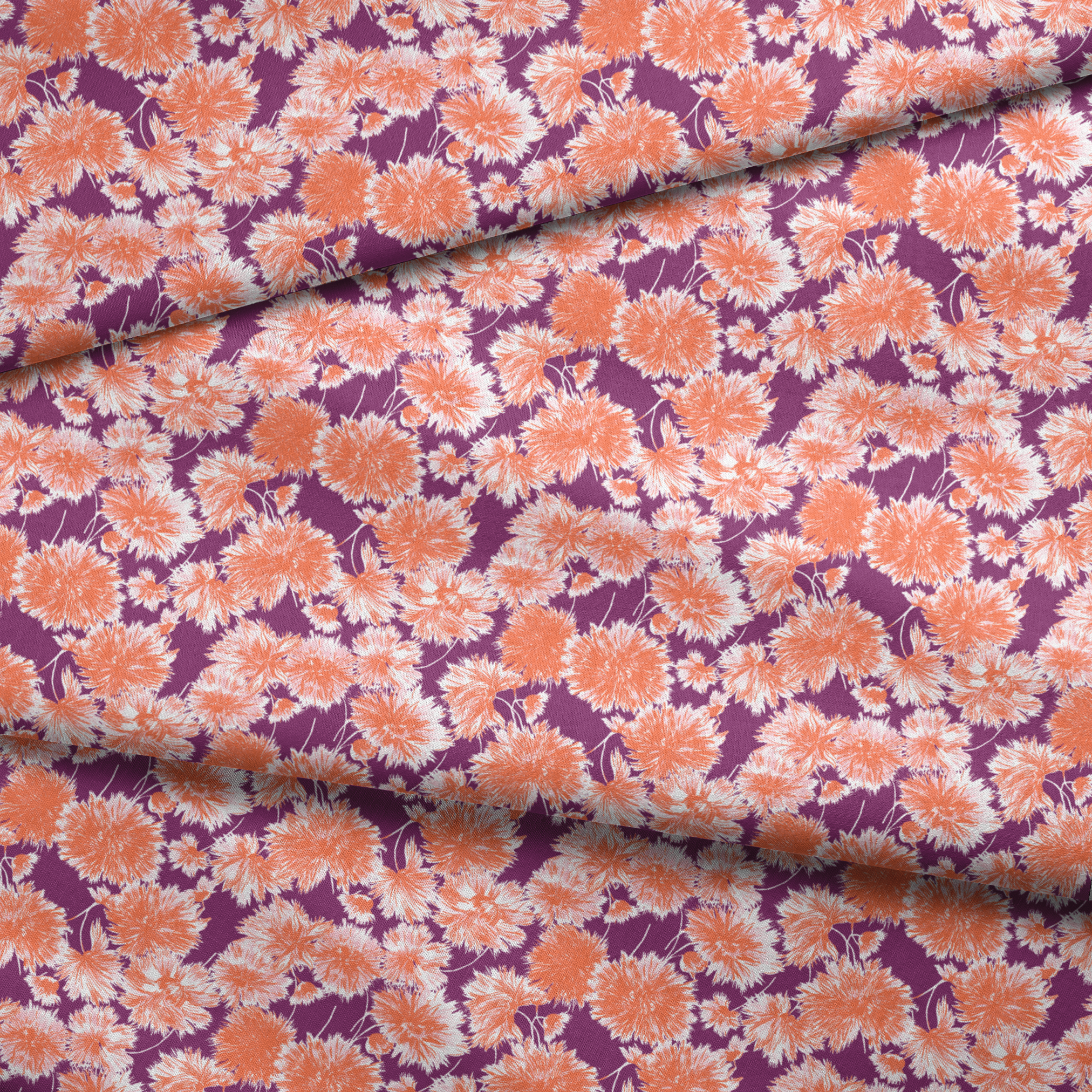 Vibrant floral pattern with orange and white chrysanthemum-like blooms on deep purple background fabric fold mockup