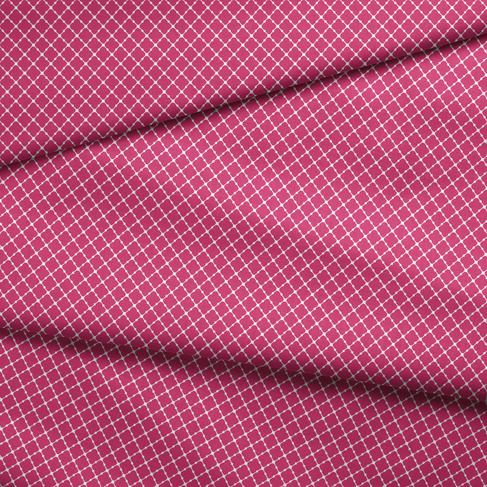 Pink quatrefoil pattern with white outlines forming a Moroccan-style geometric design fabric fold mockup
