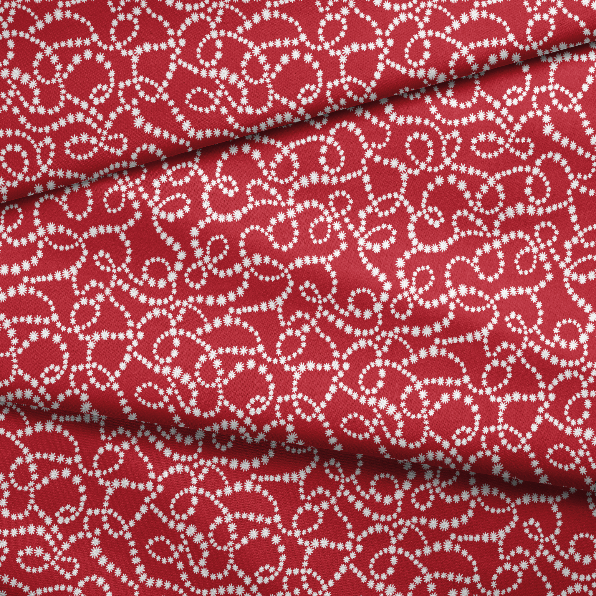 White dotted swirl pattern on rich red background creating decorative curving lines fabric fold mockup