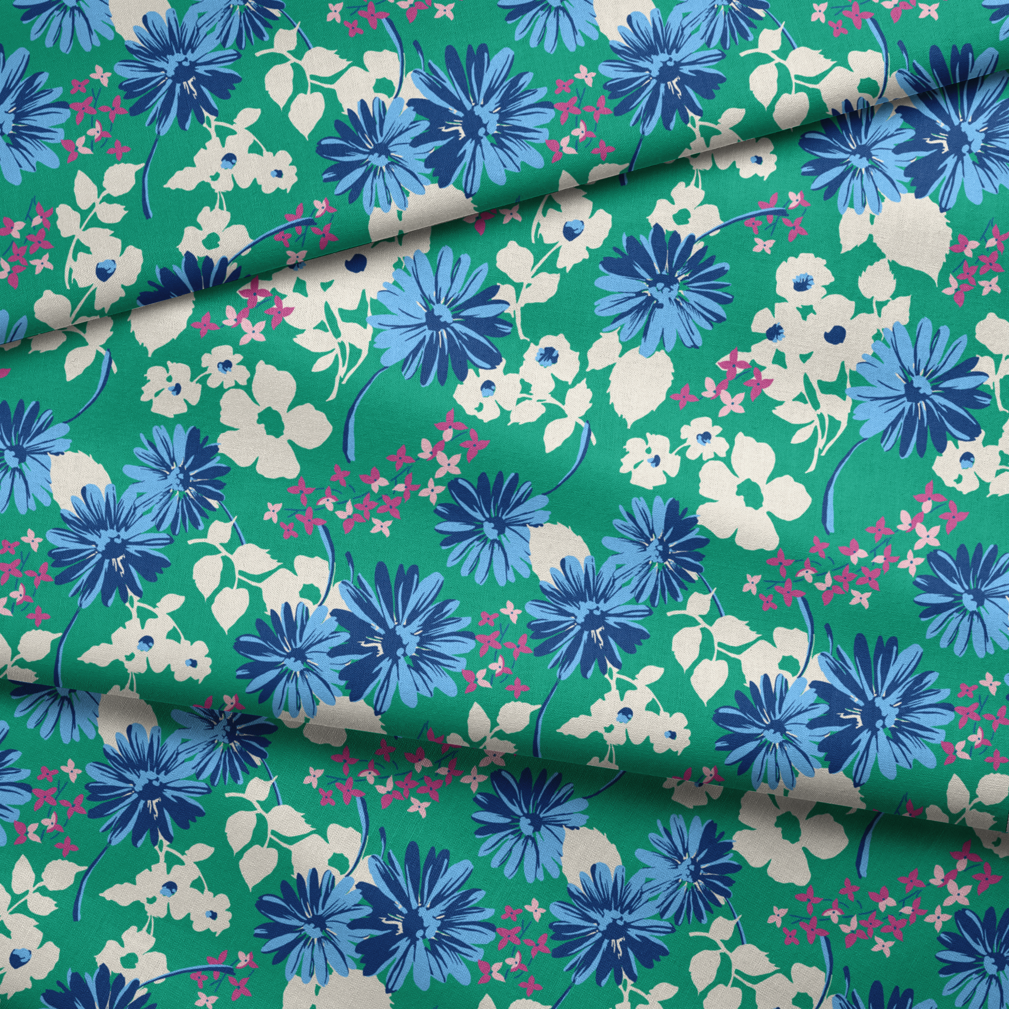 Vibrant floral pattern with blue spiky flowers and white blooms on a green background fabric fold mockup