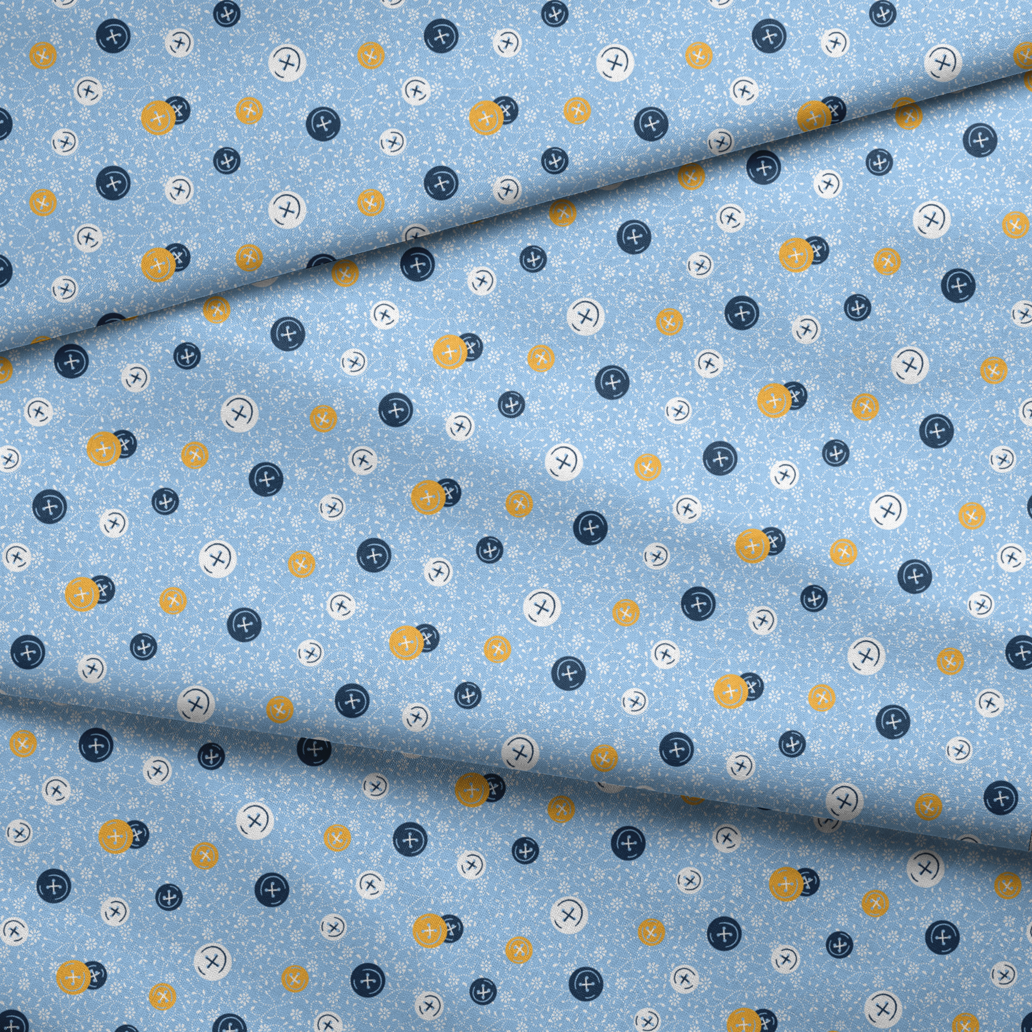 Blue background with scattered circular buttons in white, navy, and gold, each featuring cross designs, on a floral pattern. fabric fold mockup